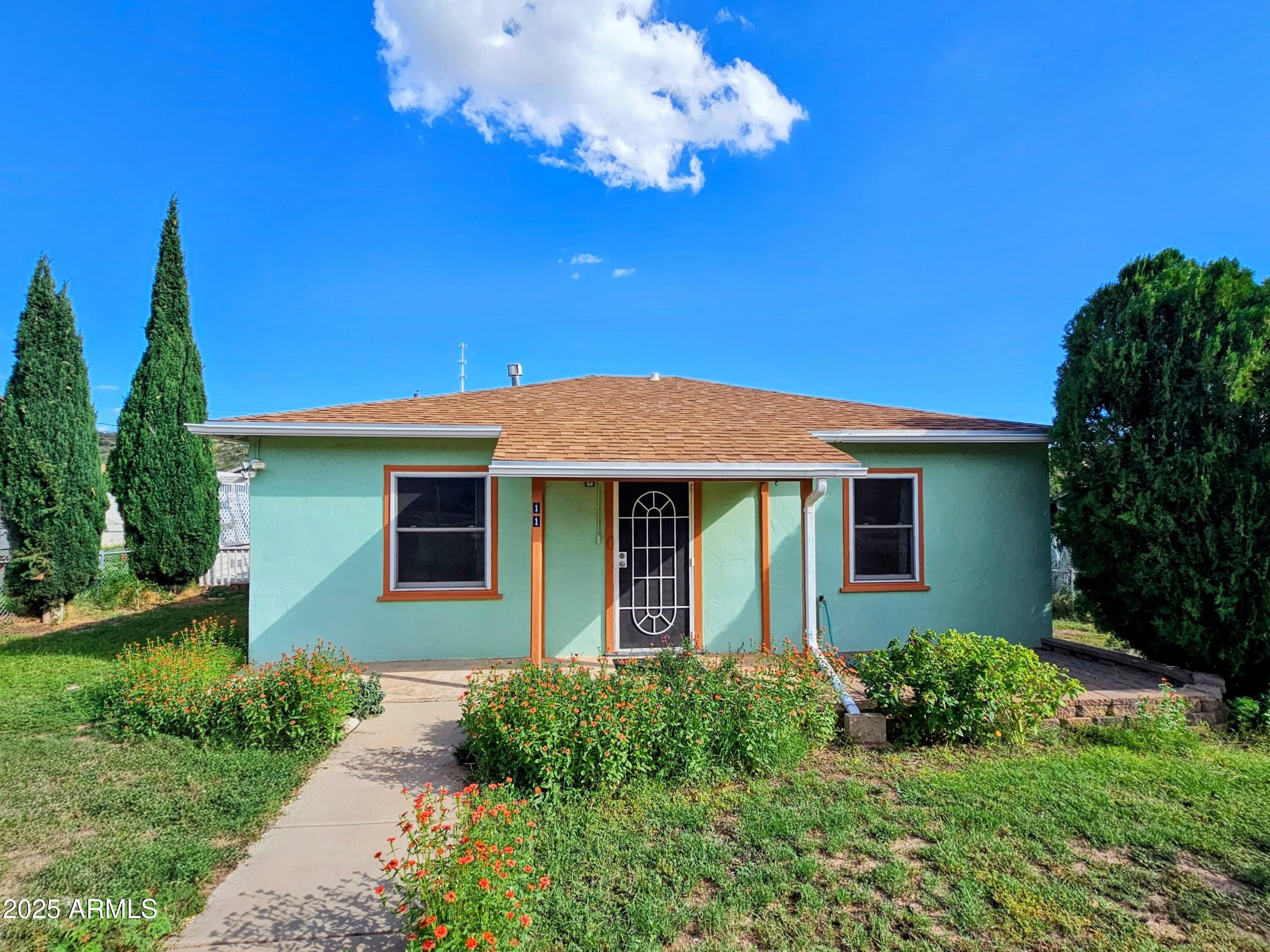 11 Bornite Avenue Bisbee, AZ 85603 - Photo 1 of 28 a front view of a house with garden