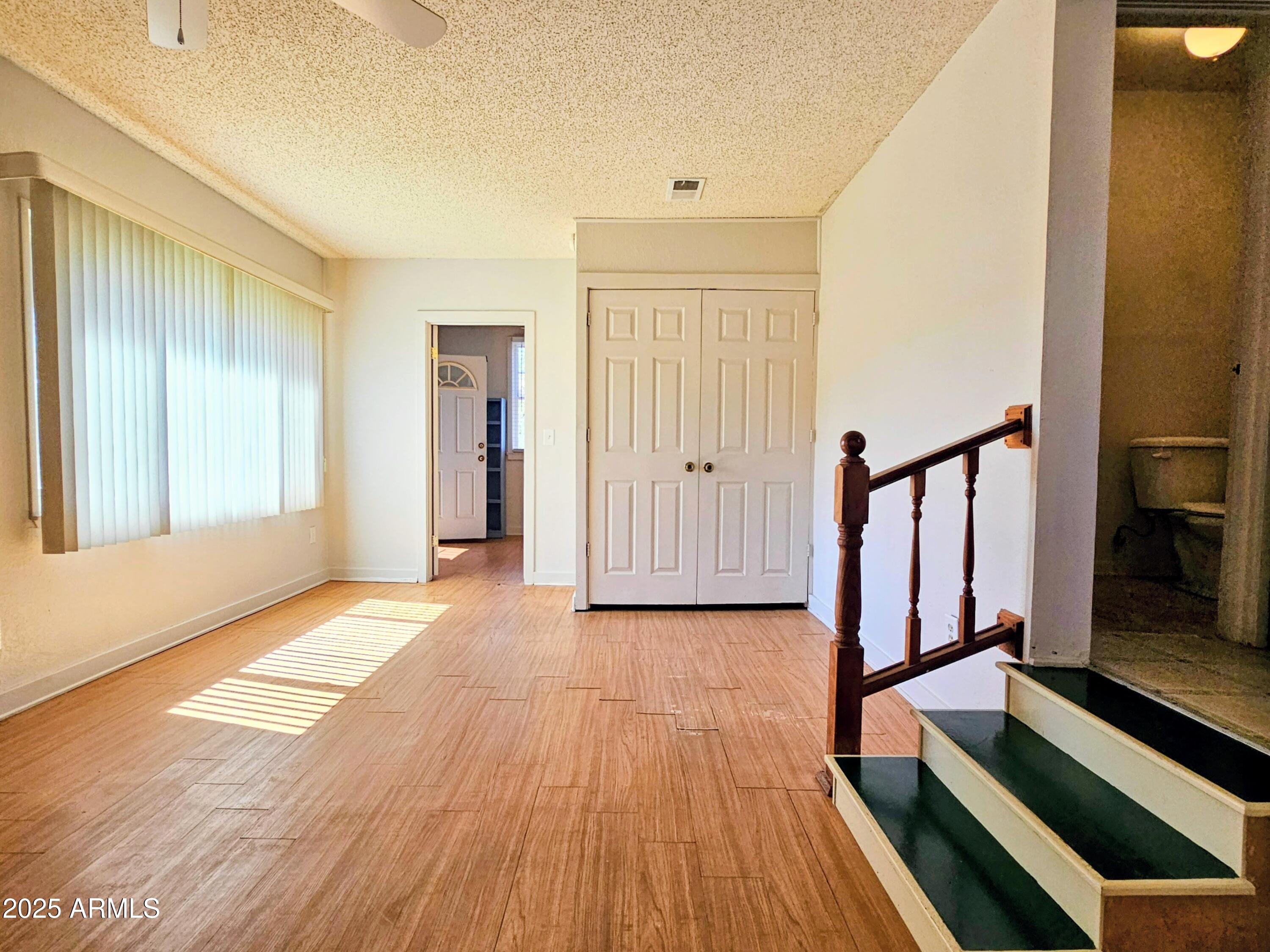 11 Bornite Avenue Bisbee, AZ 85603 - Photo 11 of 28 a view of a room with wooden floor and stairs