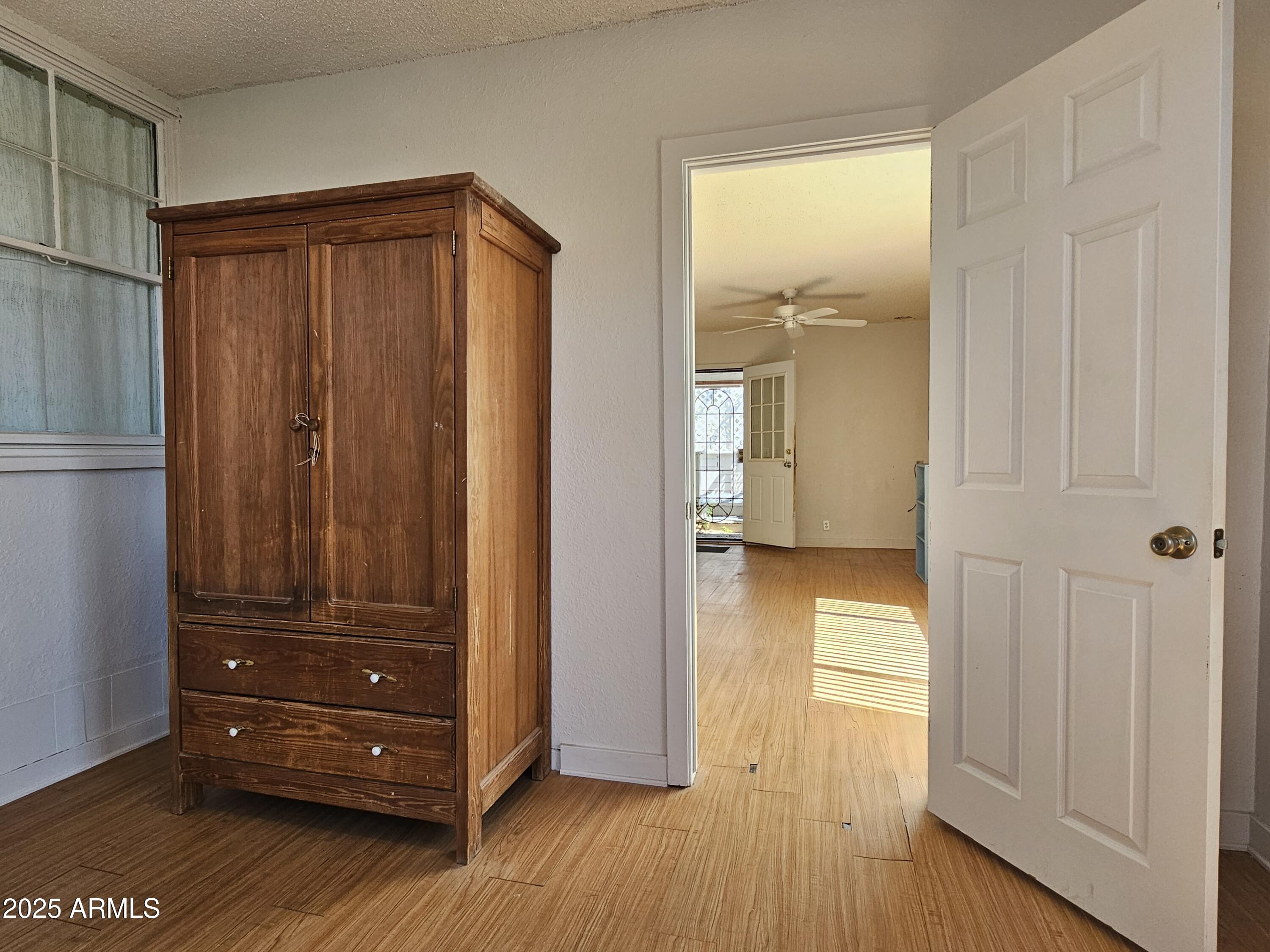 11 Bornite Avenue Bisbee, AZ 85603 - Photo 14 of 28 a view of walk in closet with wooden floor