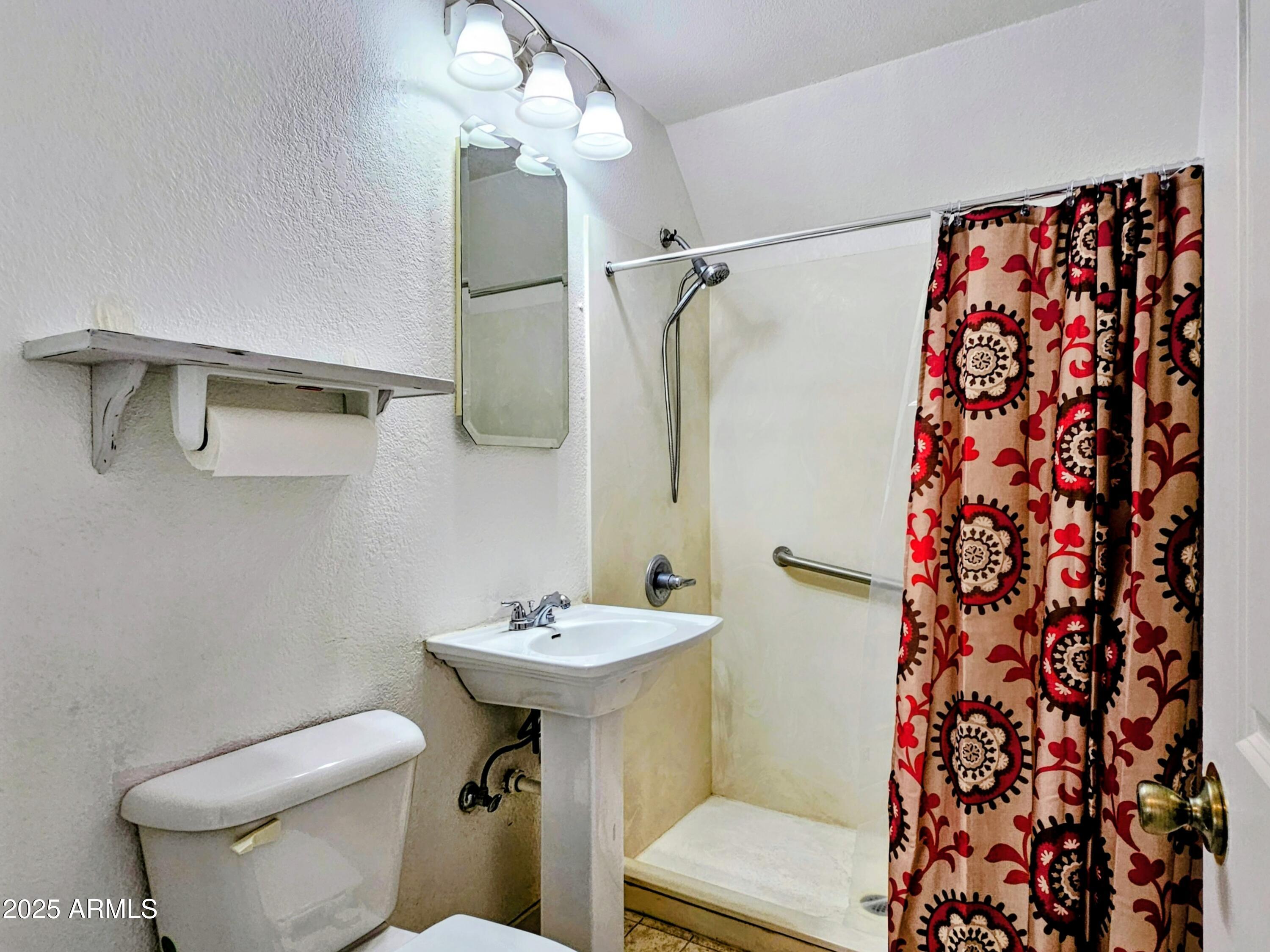 11 Bornite Avenue Bisbee, AZ 85603 - Photo 19 of 28 a bathroom with a sink toilet and shower