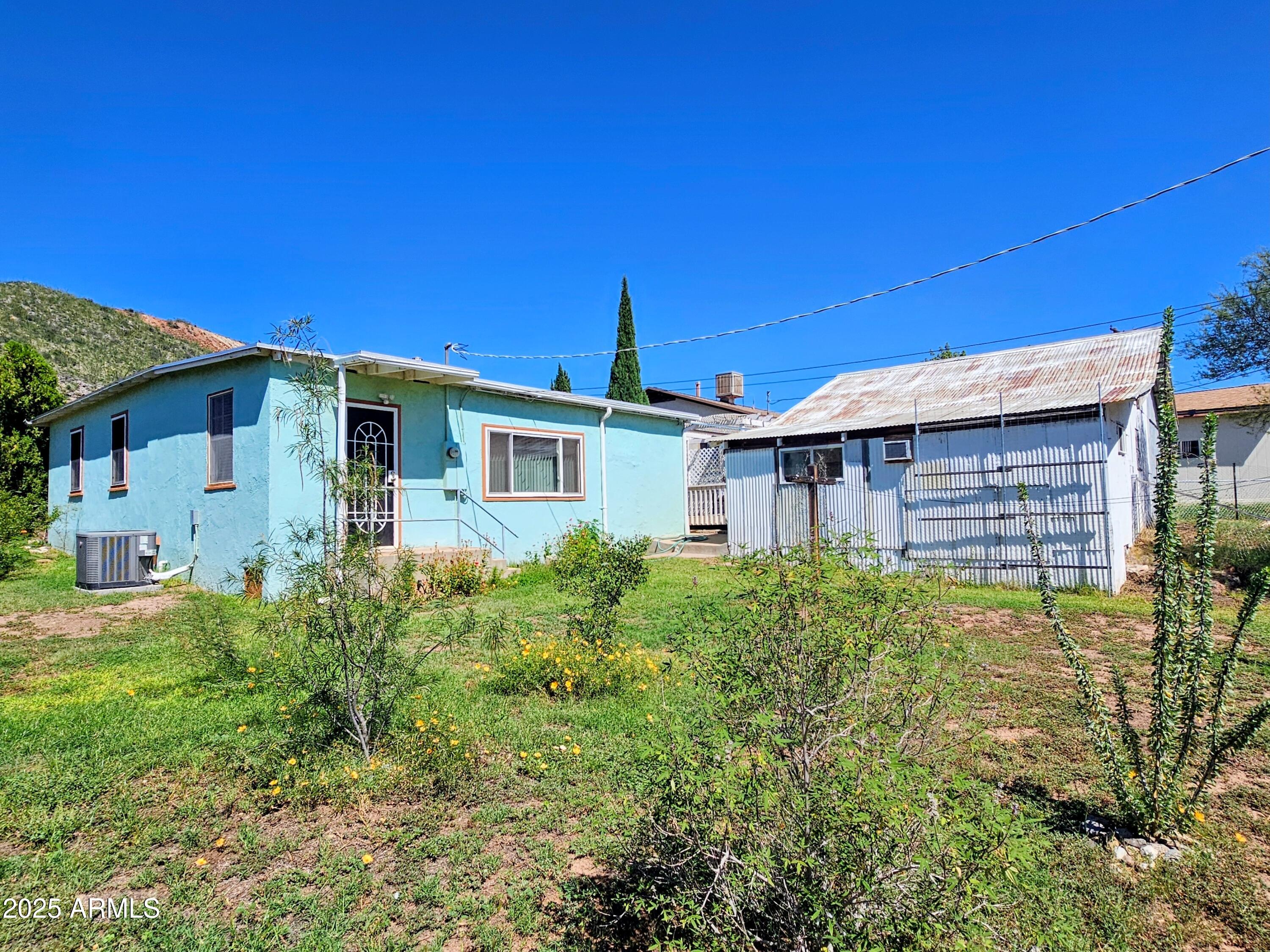 11 Bornite Avenue Bisbee, AZ 85603 - Photo 25 of 28 a front view of a house with garden