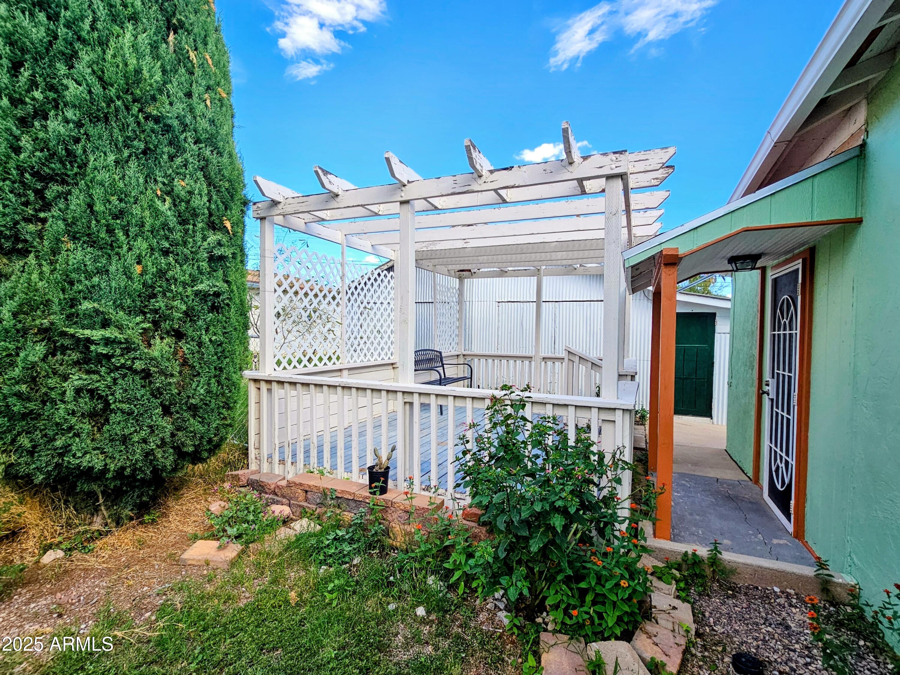 11 Bornite Avenue Bisbee, AZ 85603 - Photo 26 of 28 a view of a house with a small yard and plants
