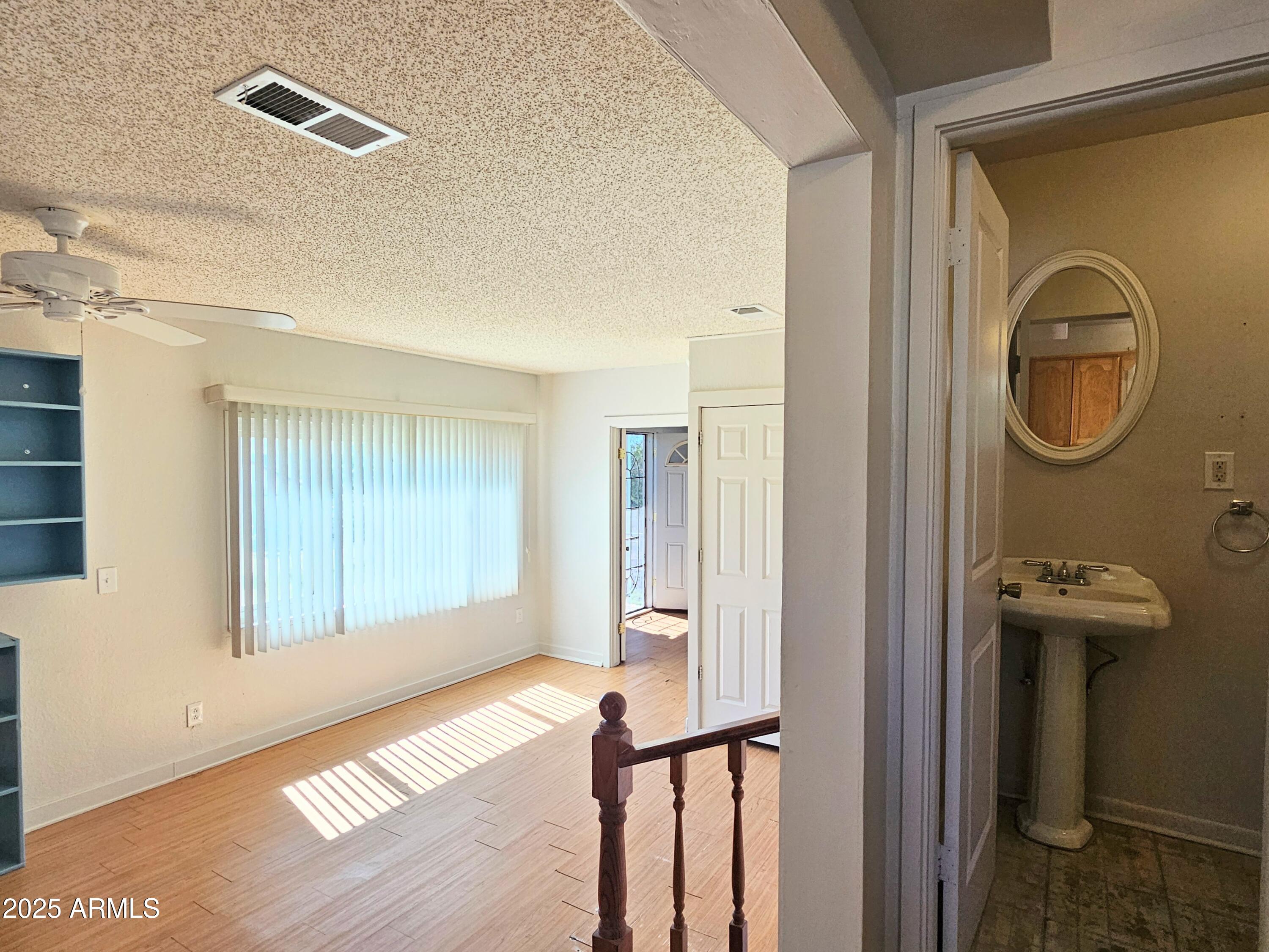 11 Bornite Avenue Bisbee, AZ 85603 - Photo 9 of 28 a view of a hallway with wooden floor and entryway