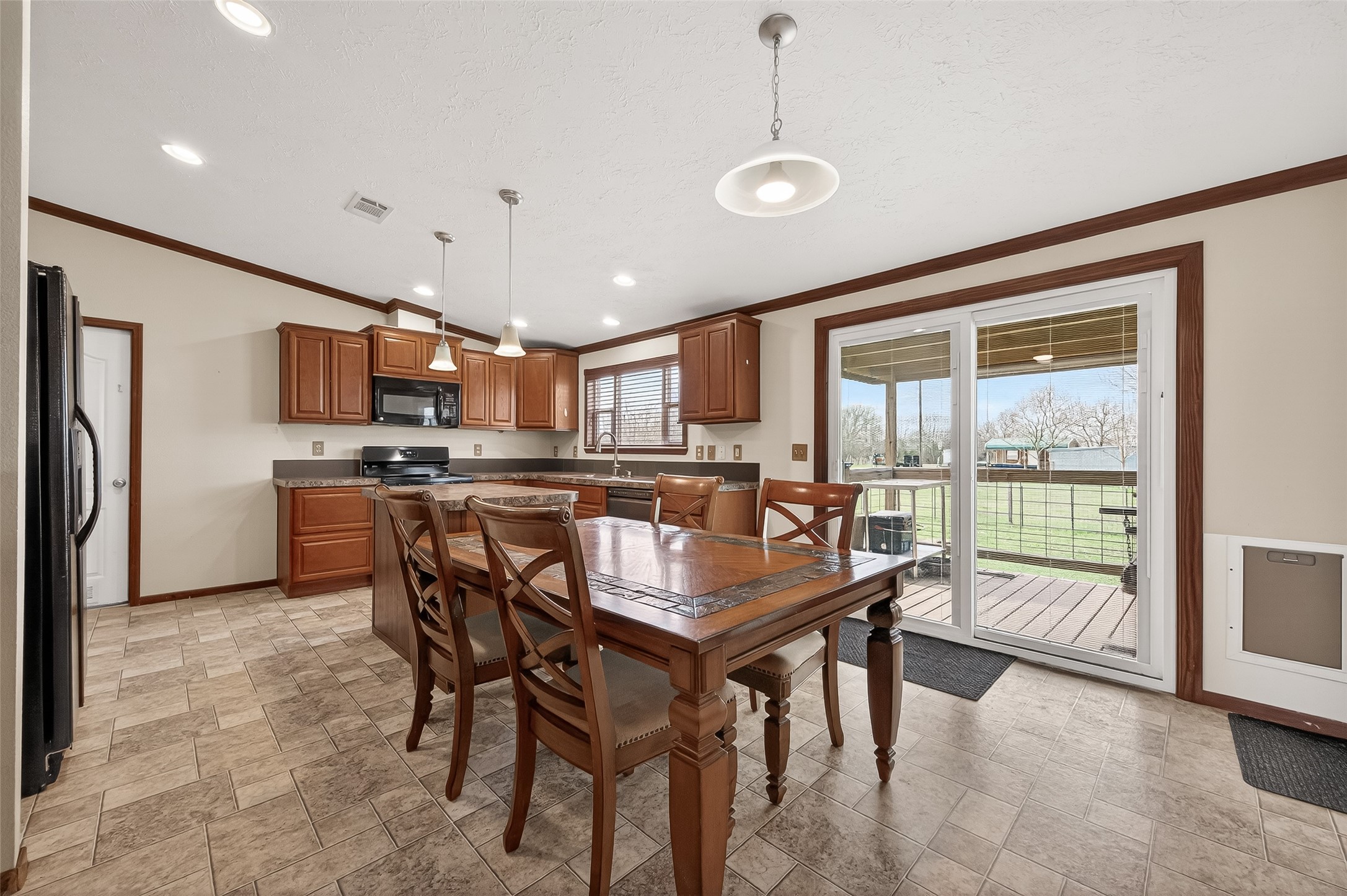 9820 Oberrender Road Needville, TX 77461 - Photo 12 of 34 Large Kitchen with Island and Sliding Doors overlooking acreage