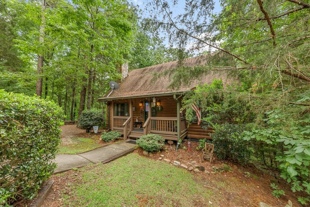 149 Mountain Springs Road Warm Springs, GA 31830 - Photo 1 of 43 an outdoor view of house with backyard and garden