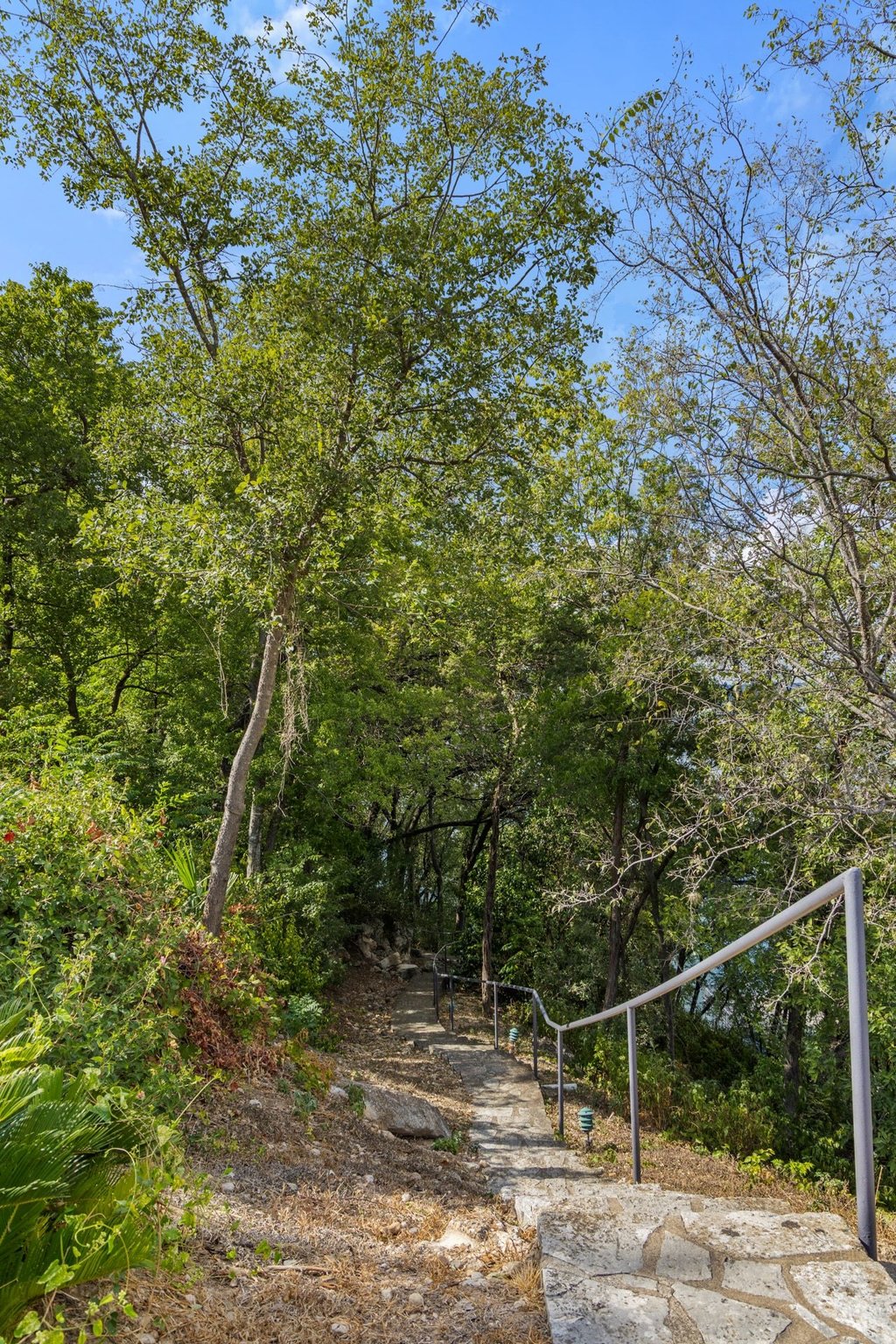 2918 Ranch Road 620 North, Unit 268 Austin, TX 78734 - Photo 36 of 40 Scenic walking trail with stone steps.