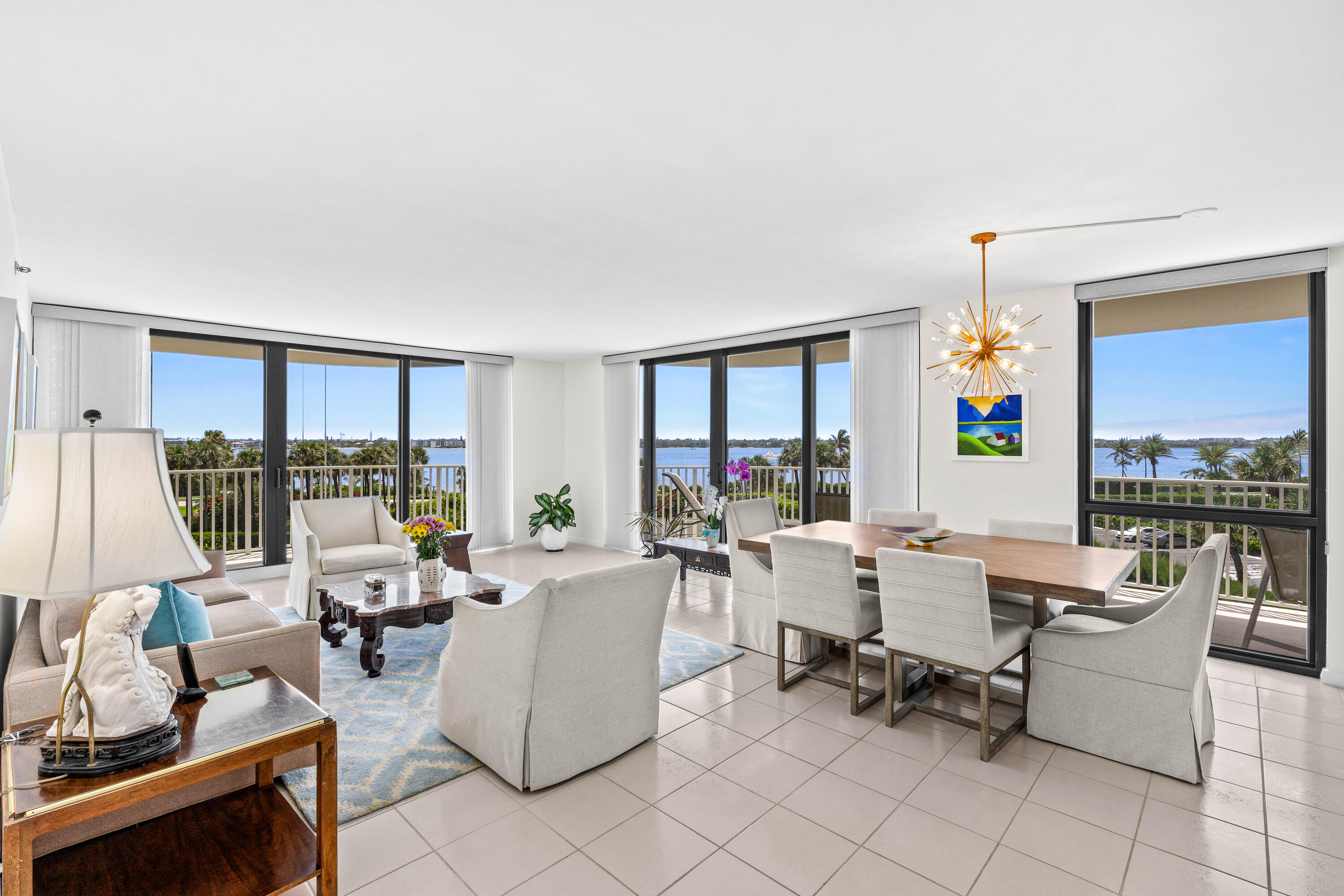 3360 South Ocean Boulevard, Unit 3 A I Palm Beach, FL 33480 - Photo 2 of 22 a living room with furniture large window and a table