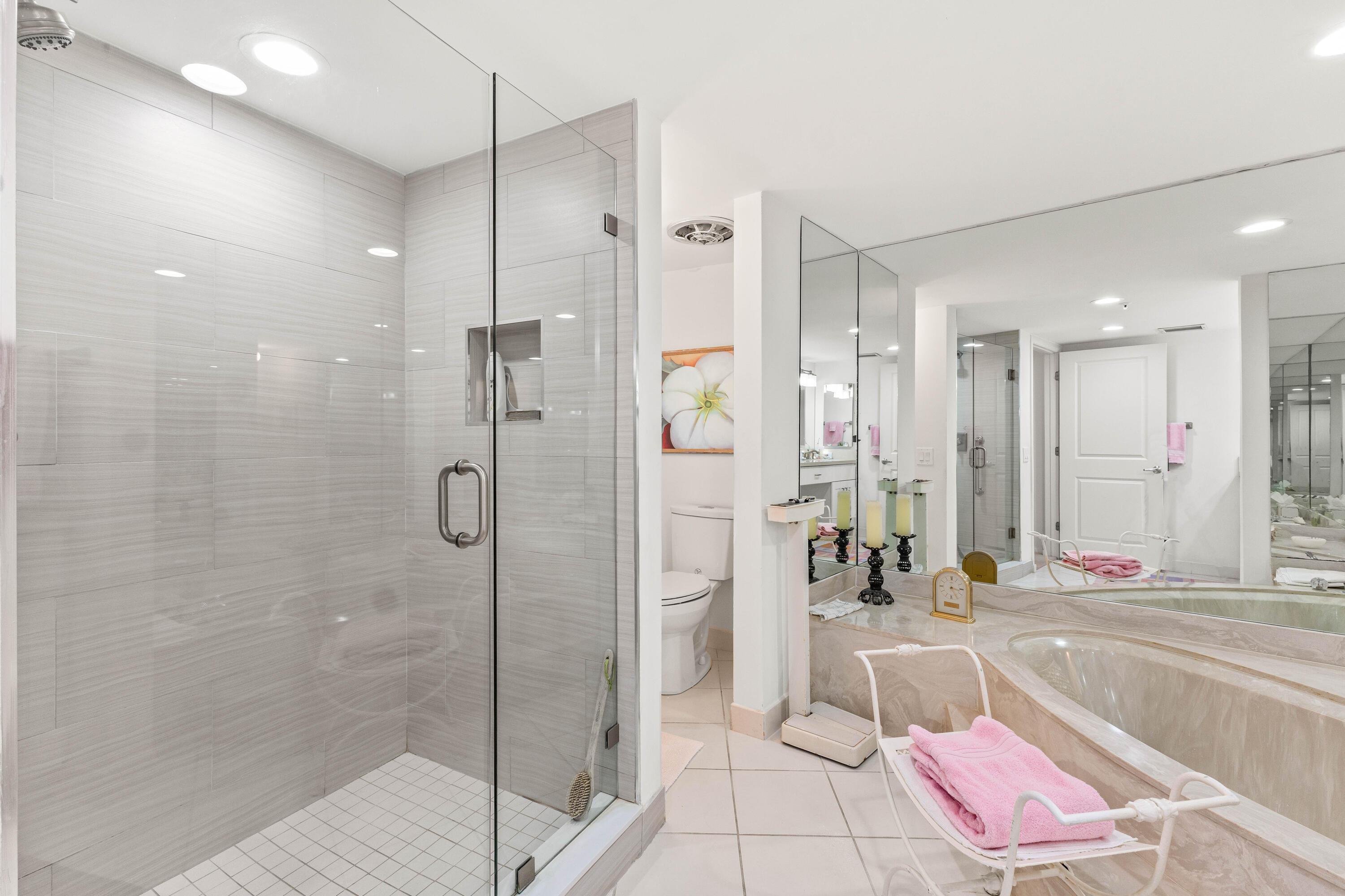 3360 South Ocean Boulevard, Unit 3 A I Palm Beach, FL 33480 - Photo 8 of 22 a bathroom with a tub shower and mirror