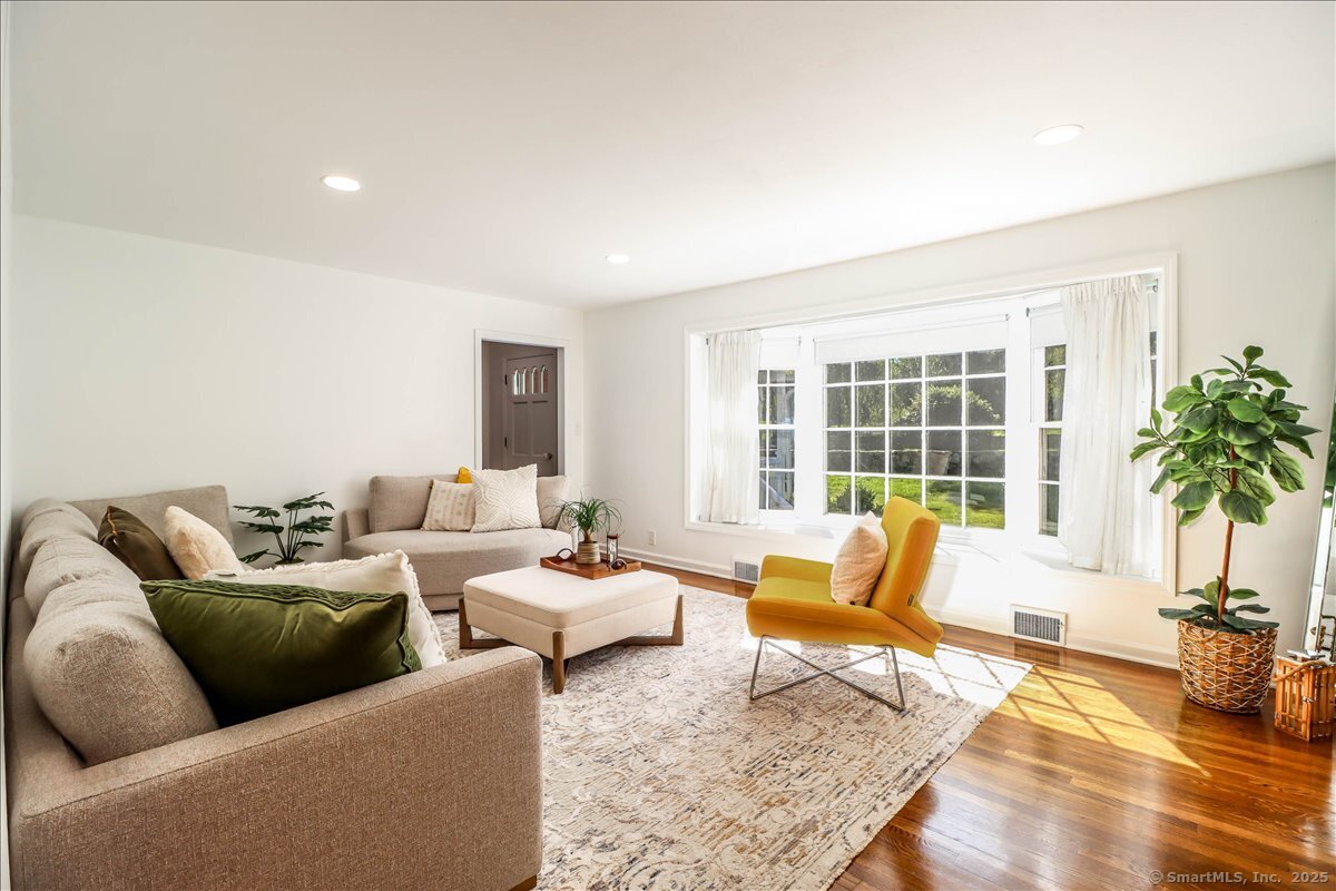 46 White Birch Road Ridgefield, CT 06877 - Photo 12 of 31 a living room with furniture and floor to ceiling window