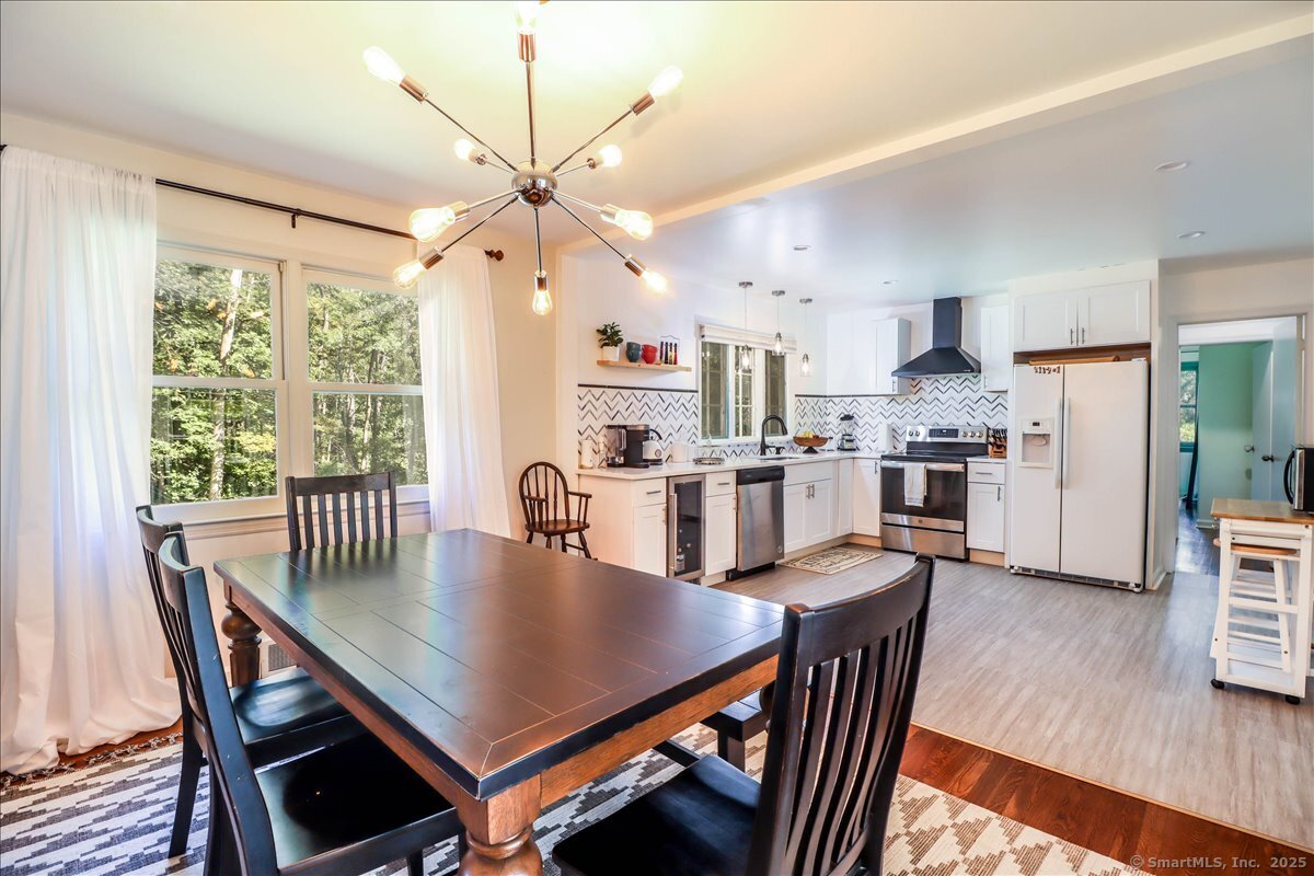 46 White Birch Road Ridgefield, CT 06877 - Photo 16 of 31 a open dining room with stainless steel appliances furniture a window and kitchen view