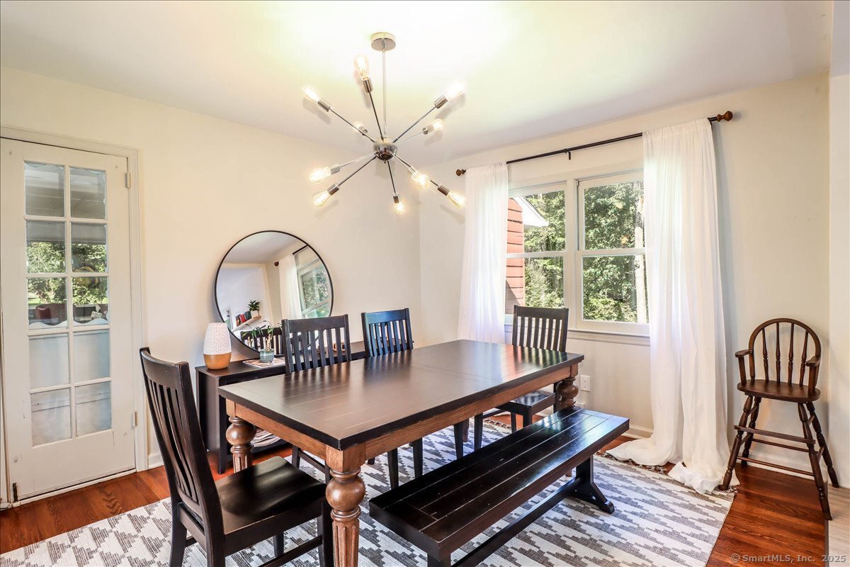 46 White Birch Road Ridgefield, CT 06877 - Photo 17 of 31 a view of a dining room with furniture window and wooden floor