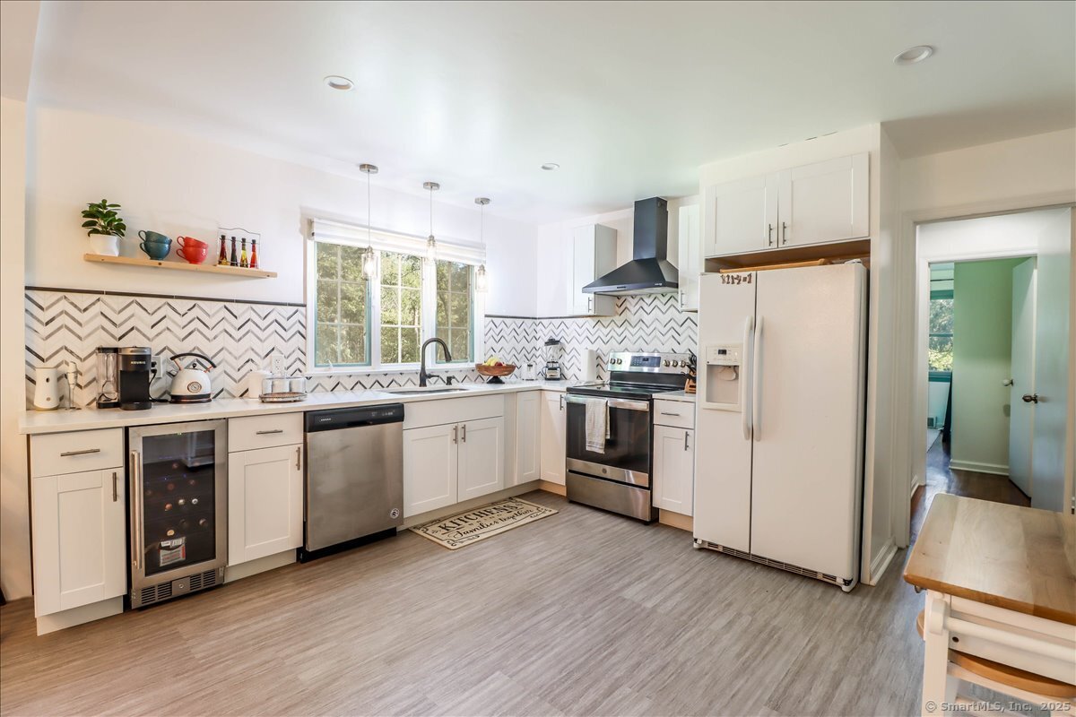 46 White Birch Road Ridgefield, CT 06877 - Photo 18 of 31 a kitchen with white cabinets and white appliances
