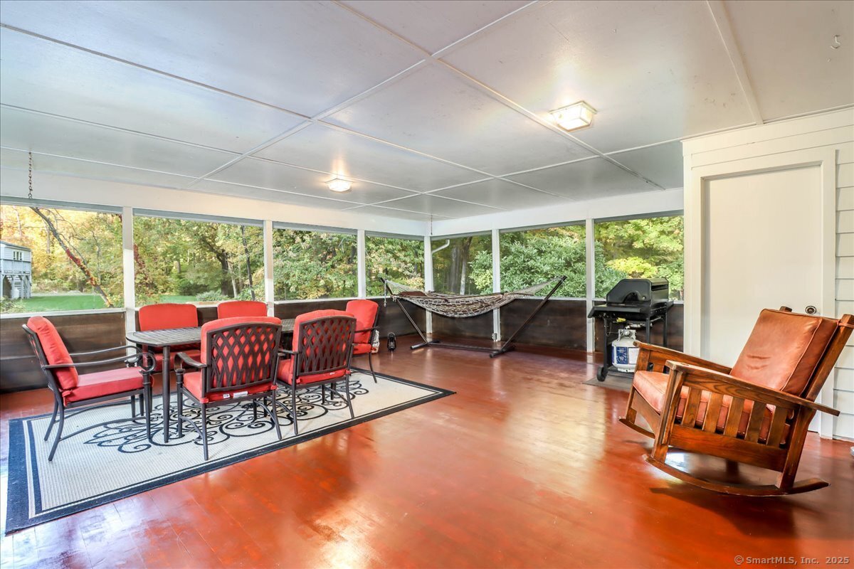 46 White Birch Road Ridgefield, CT 06877 - Photo 20 of 31 a living room with furniture and a floor to ceiling window