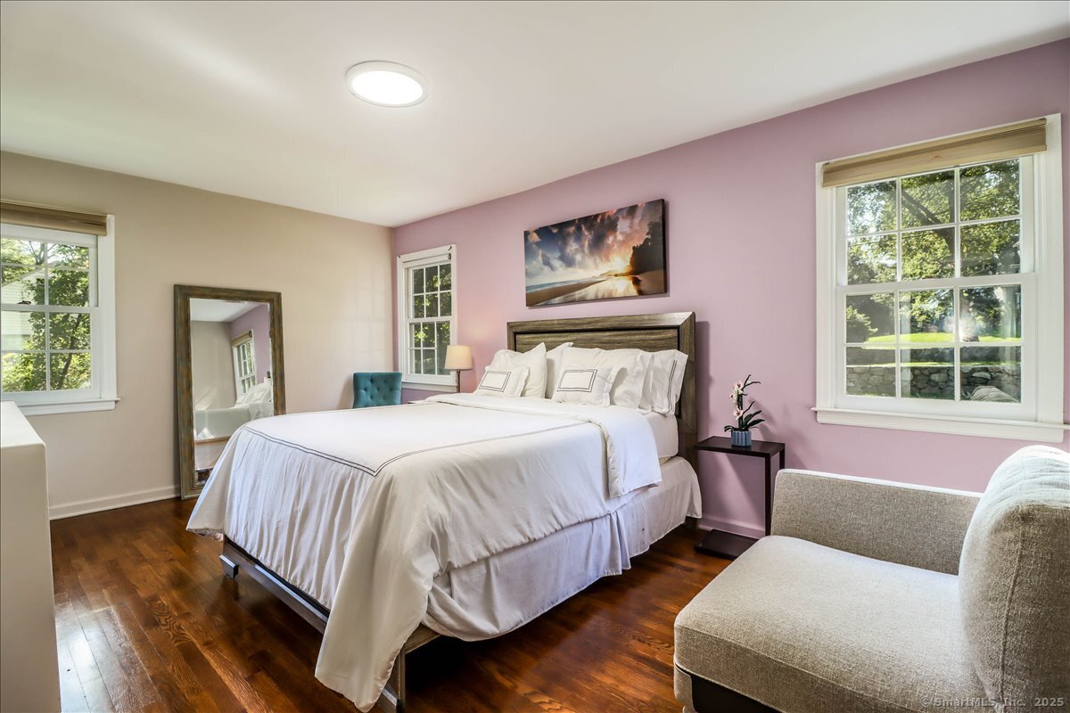 46 White Birch Road Ridgefield, CT 06877 - Photo 22 of 31 a bedroom with bed and wooden floor