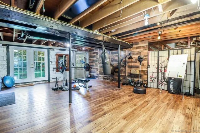 a view of a house with a big yard and large trees