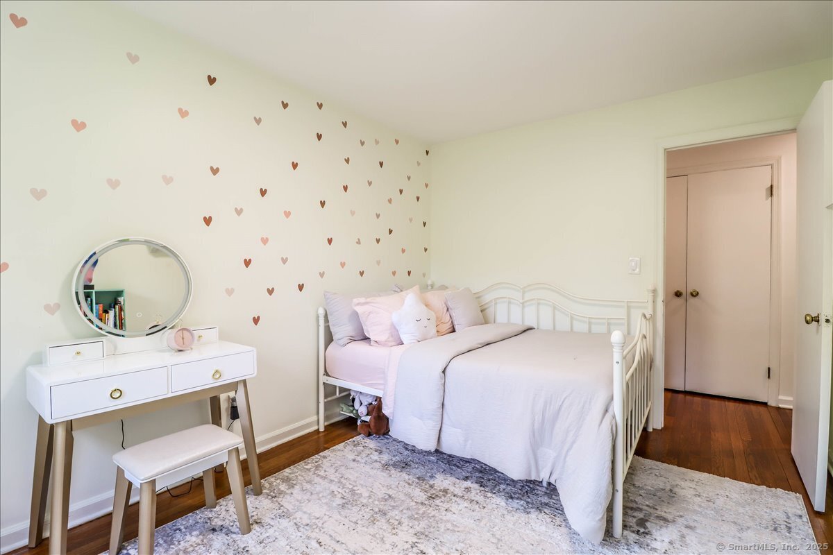 46 White Birch Road Ridgefield, CT 06877 - Photo 26 of 31 a bedroom with a bed and wooden floor