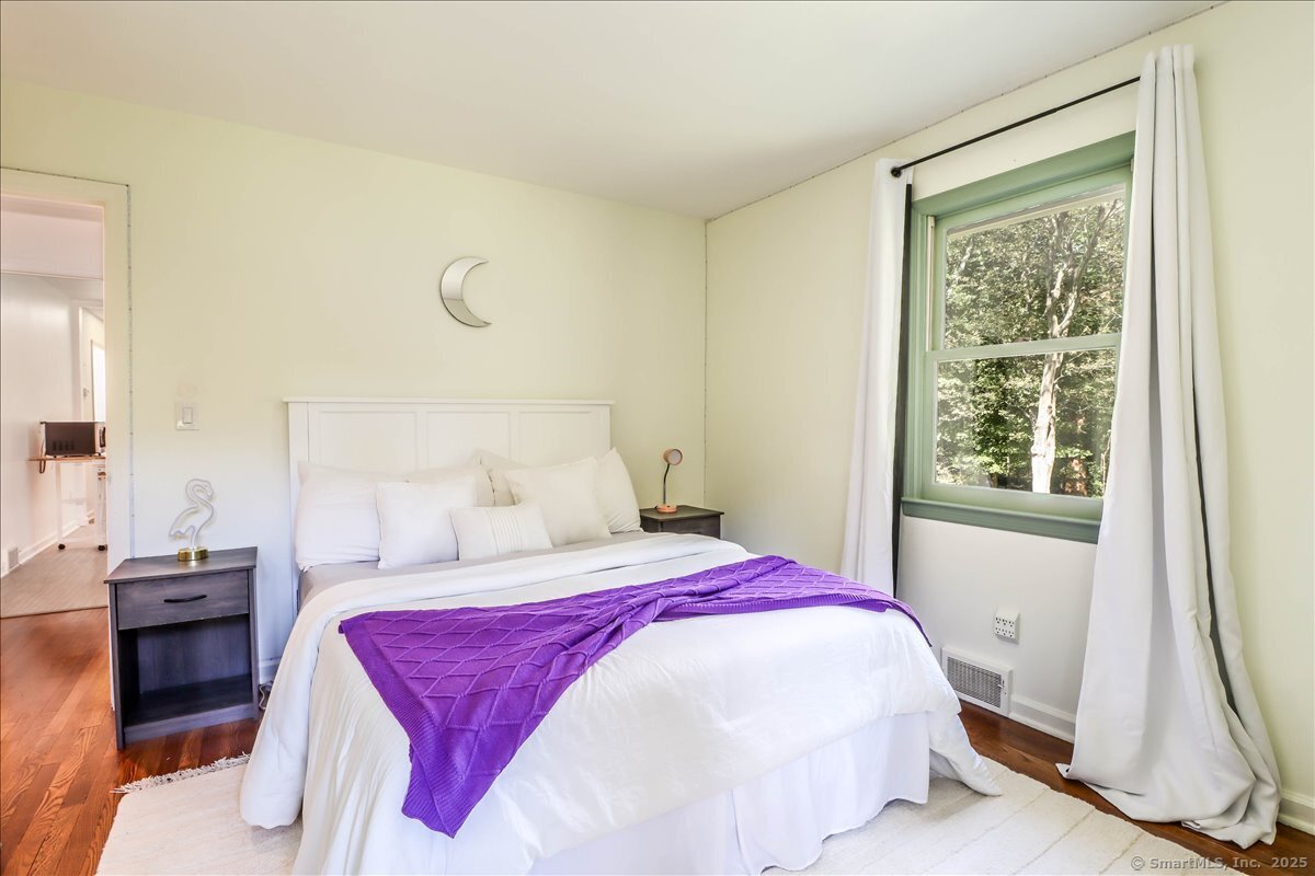46 White Birch Road Ridgefield, CT 06877 - Photo 28 of 31 a bedroom with a bed and a window