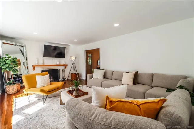 a open dining room with stainless steel appliances furniture a window and kitchen view