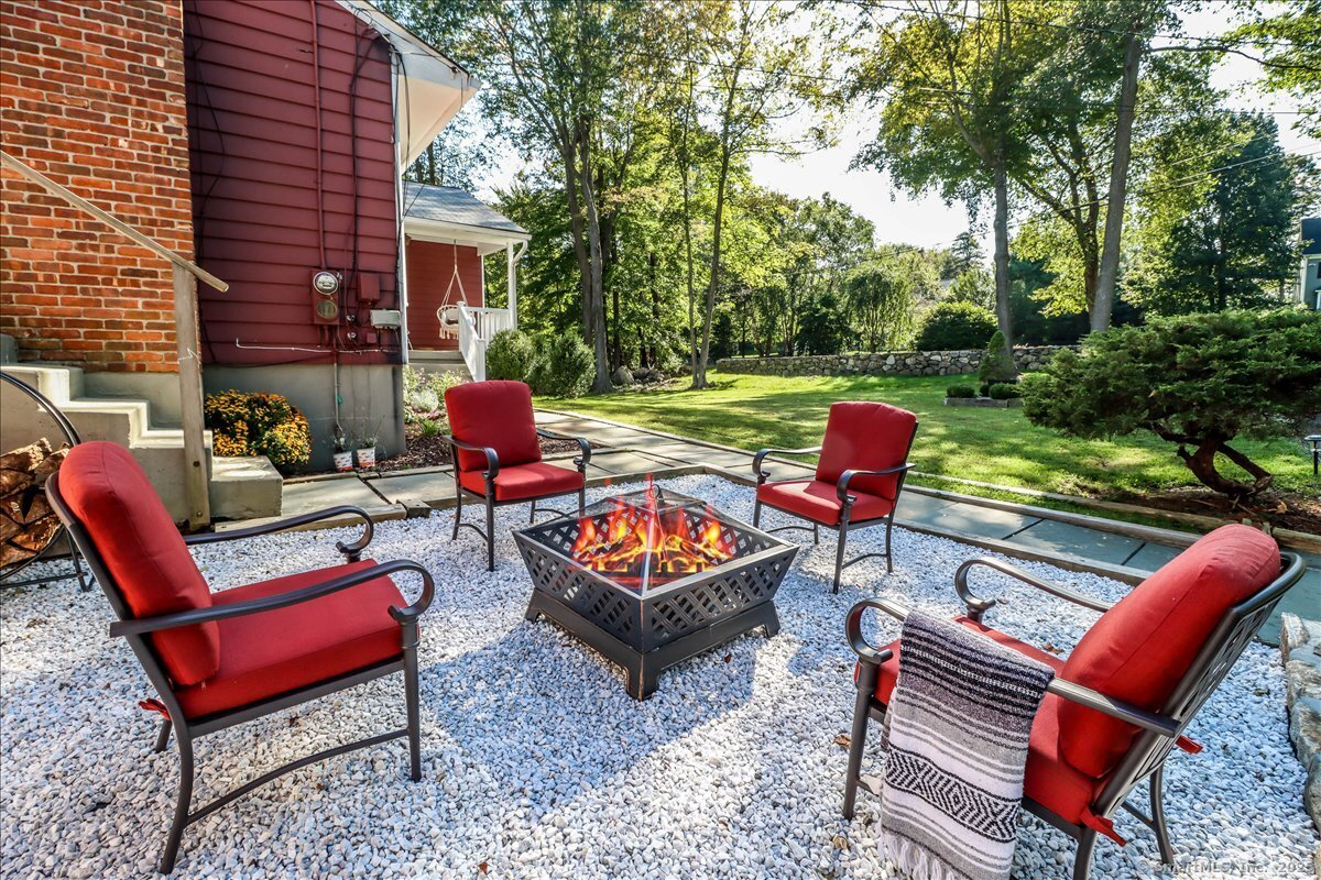 46 White Birch Road Ridgefield, CT 06877 - Photo 8 of 31 an outdoor sitting area with a couch and an outdoor seating