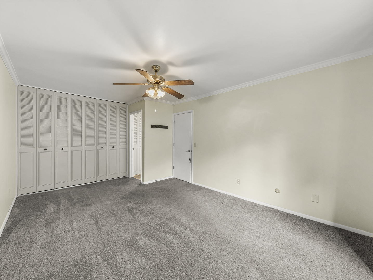 16 Shermead Road Montgomery, IL 60538 - Photo 18 of 22 an empty room with a ceiling fan and a window