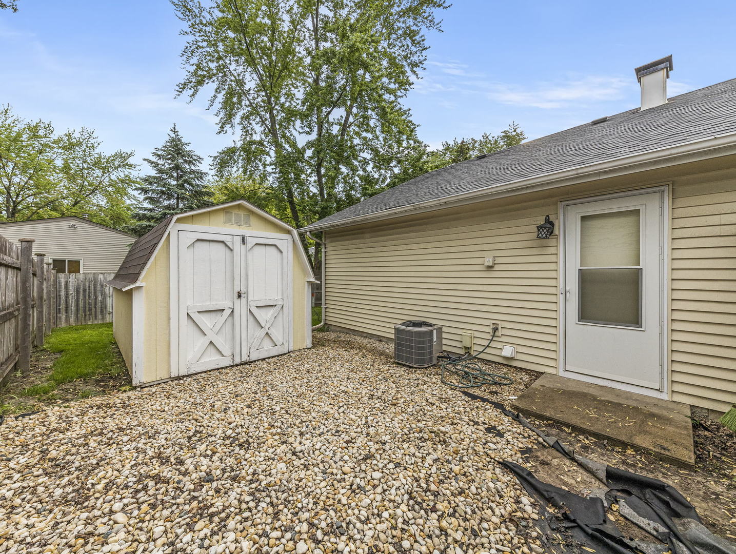 16 Shermead Road Montgomery, IL 60538 - Photo 20 of 22 a backyard of a house with yard and outdoor seating