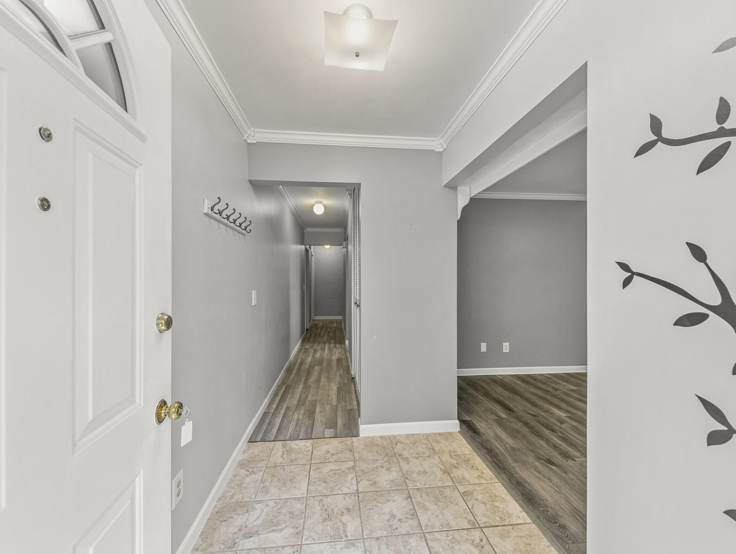16 Shermead Road Montgomery, IL 60538 - Photo 3 of 22 a view of a hallway with wooden floor and staircase