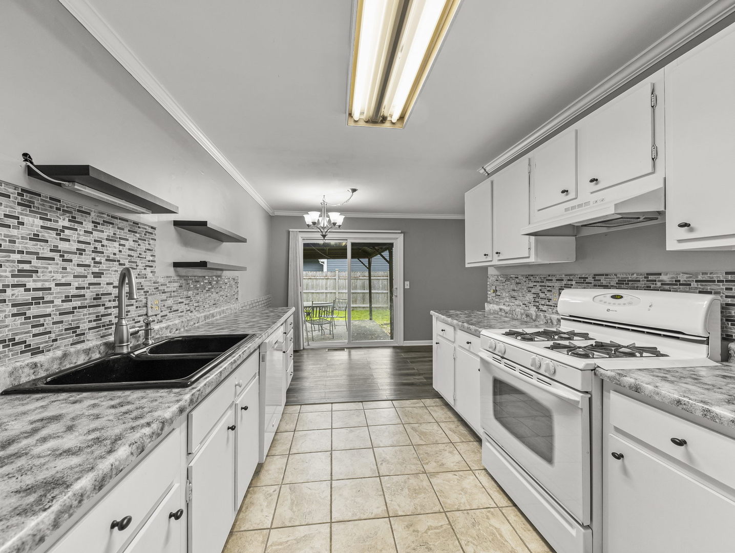 16 Shermead Road Montgomery, IL 60538 - Photo 10 of 22 a kitchen with stainless steel appliances a stove sink and cabinets