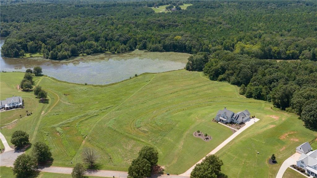 825 North Hampton Way Monroe, GA 30656 - Photo 12 of 31 a view of a swimming pool with a yard