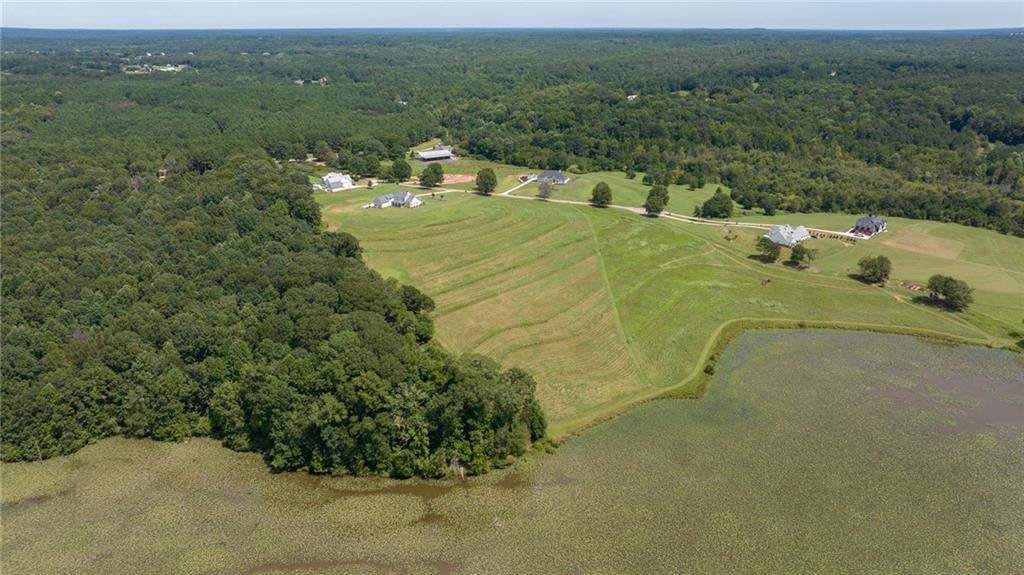 825 North Hampton Way Monroe, GA 30656 - Photo 15 of 31 a view of a water pond with green field