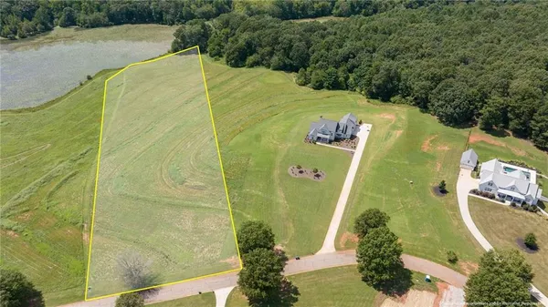 a view of a swimming pool with a yard