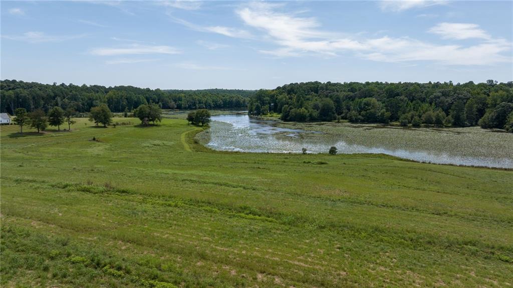 825 North Hampton Way Monroe, GA 30656 - Photo 22 of 31 a view of garden with trees in the background