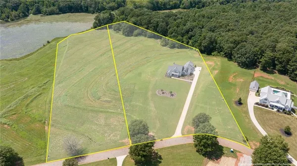 a view of a swimming pool with a yard