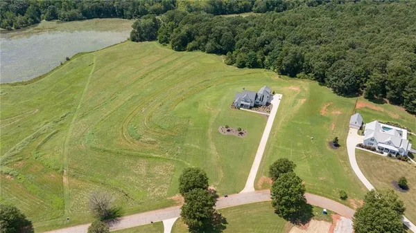 a view of a swimming pool with a yard
