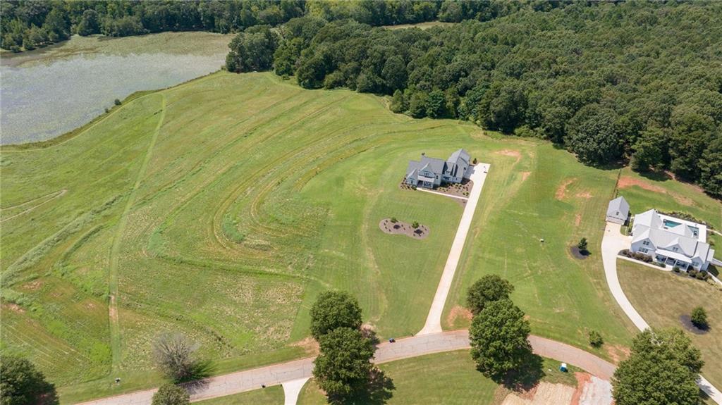 825 North Hampton Way Monroe, GA 30656 - Photo 4 of 31 a view of a swimming pool with a yard