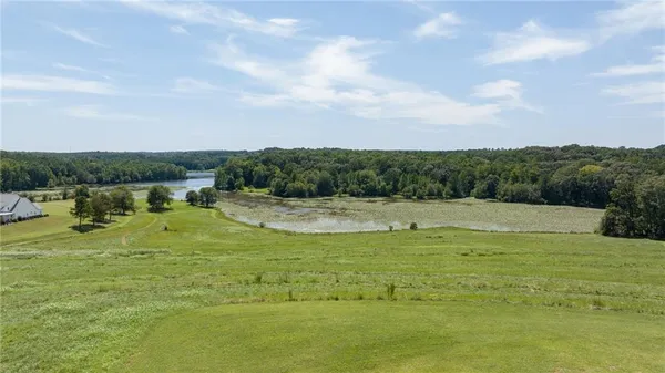 a view of a swimming pool with a yard