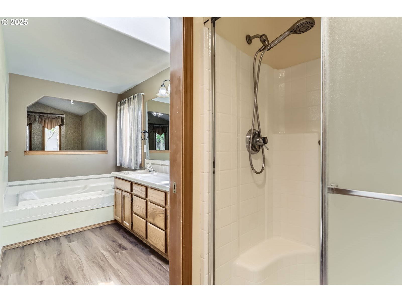 257 Southwest Nancy Circle Gresham, OR 97030 - Photo 19 of 36 a en suite bathroom with a granite countertop sink mirror and bathtub