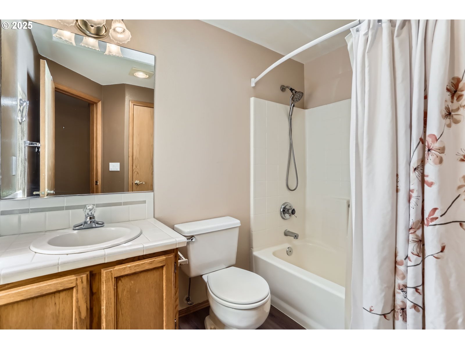257 Southwest Nancy Circle Gresham, OR 97030 - Photo 24 of 36 a bathroom with a granite countertop sink toilet and shower