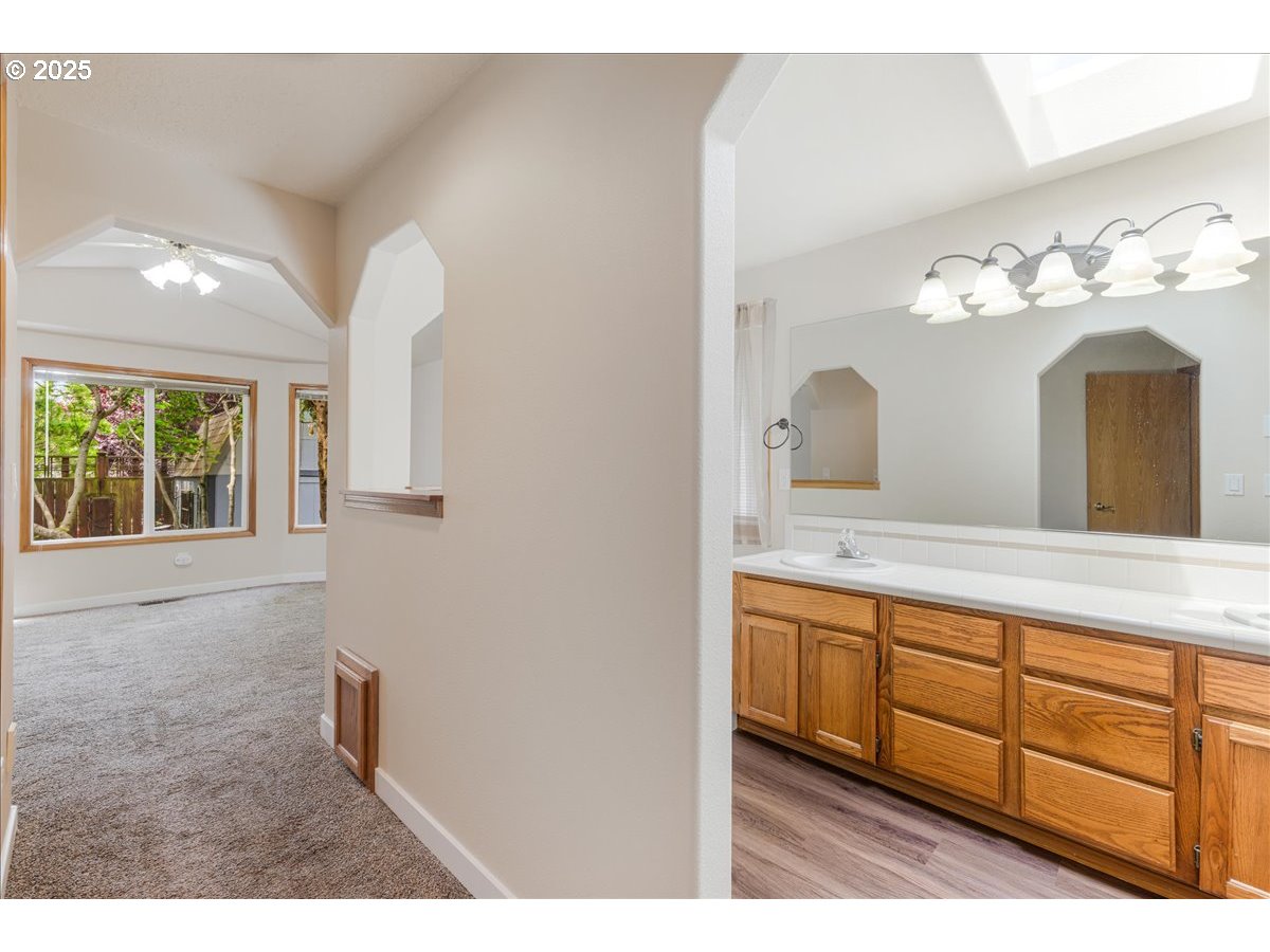 257 Southwest Nancy Circle Gresham, OR 97030 - Photo 32 of 36 a bathroom with a sink and a mirror