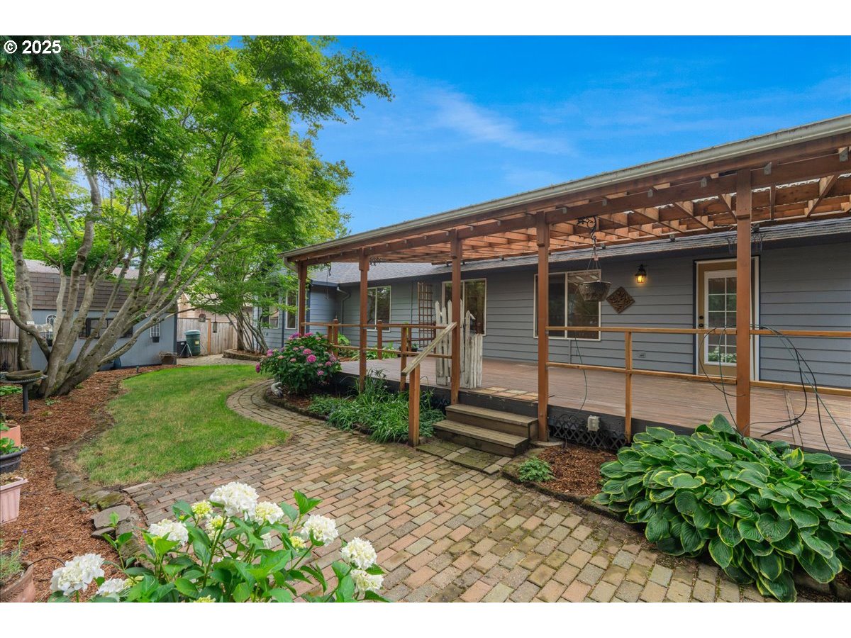 257 Southwest Nancy Circle Gresham, OR 97030 - Photo 35 of 36 a view of a house with a yard