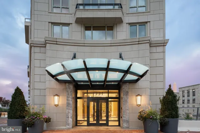 a view of entryway with a front door and wooden floor