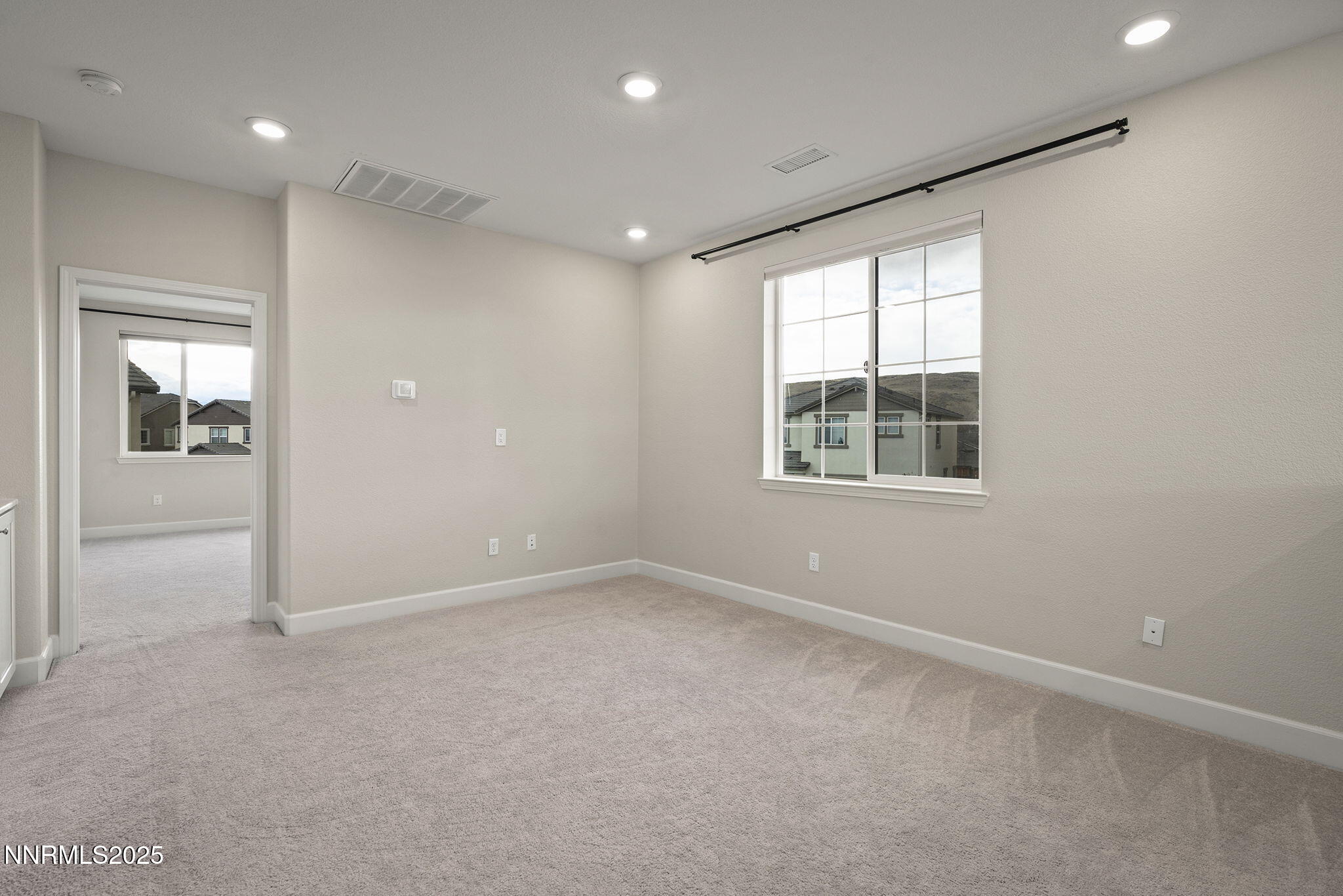 1119 Roswell Road Sparks, NV 89436 - Photo 18 of 35 an empty room with windows and closet
