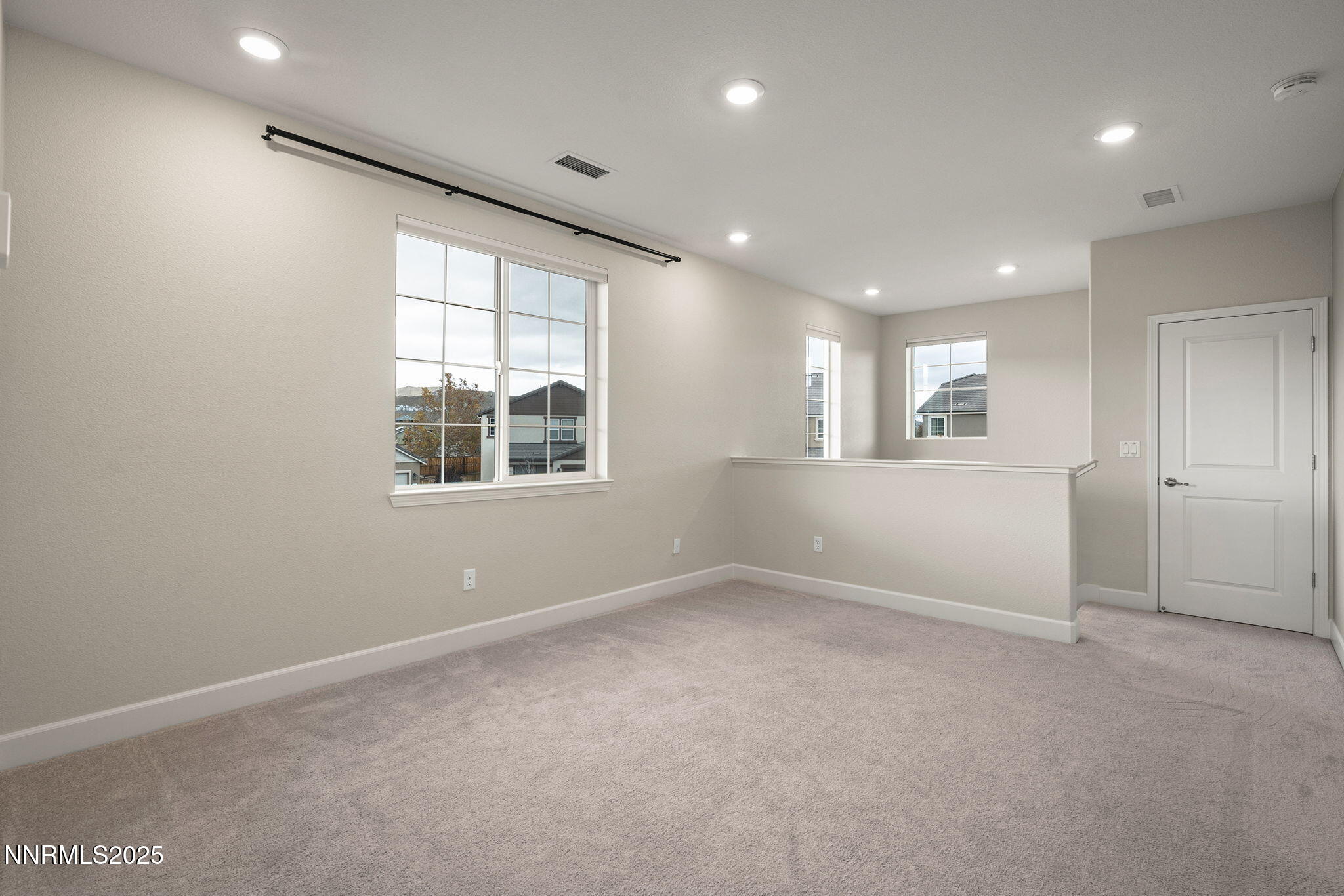 1119 Roswell Road Sparks, NV 89436 - Photo 19 of 35 an empty room with windows and closet