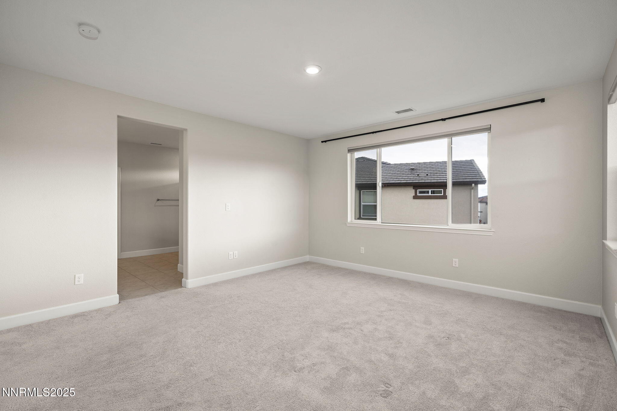 1119 Roswell Road Sparks, NV 89436 - Photo 21 of 35 a view of an empty room with a window