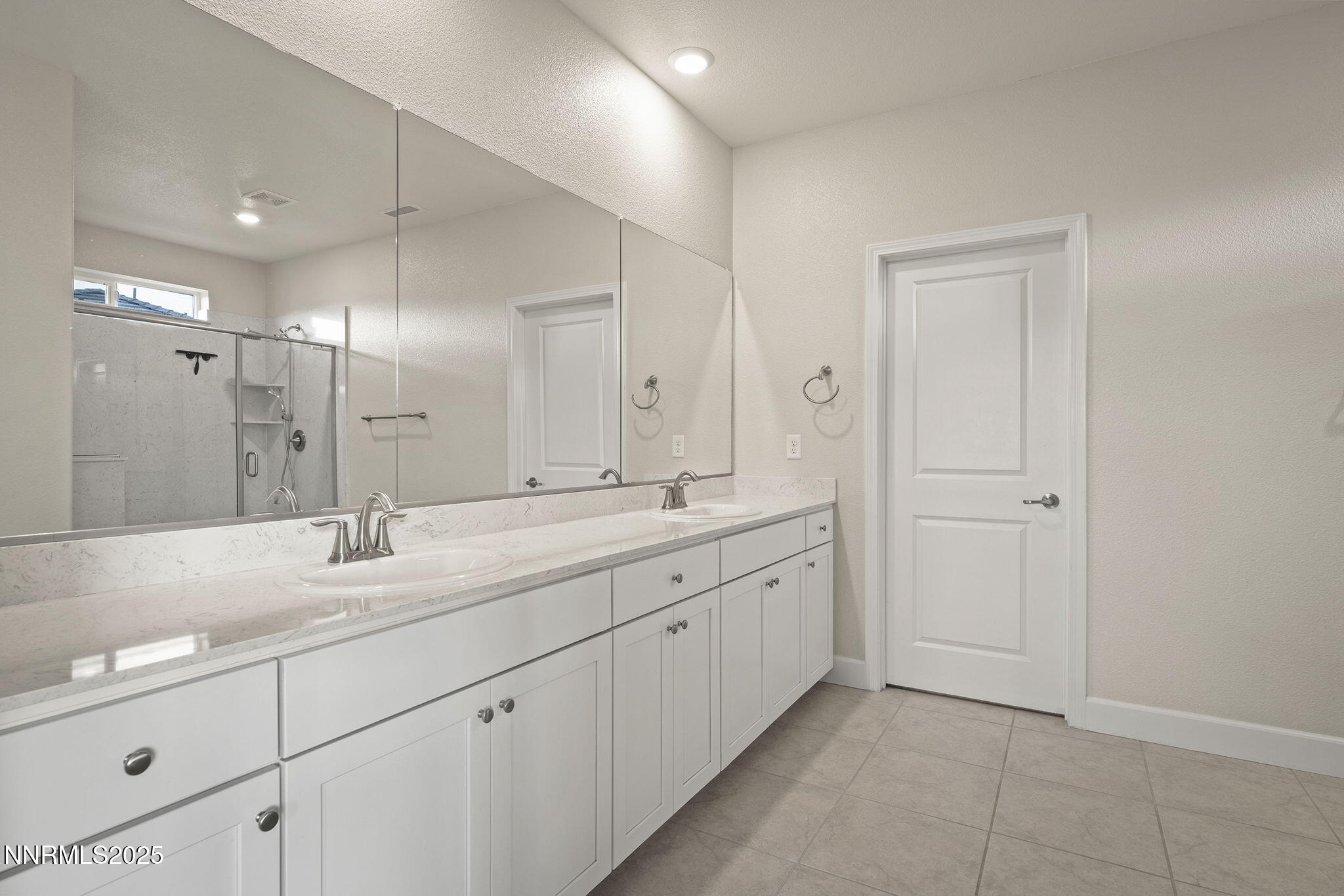 1119 Roswell Road Sparks, NV 89436 - Photo 22 of 35 a spacious bathroom with a granite countertop sink a mirror and a shower