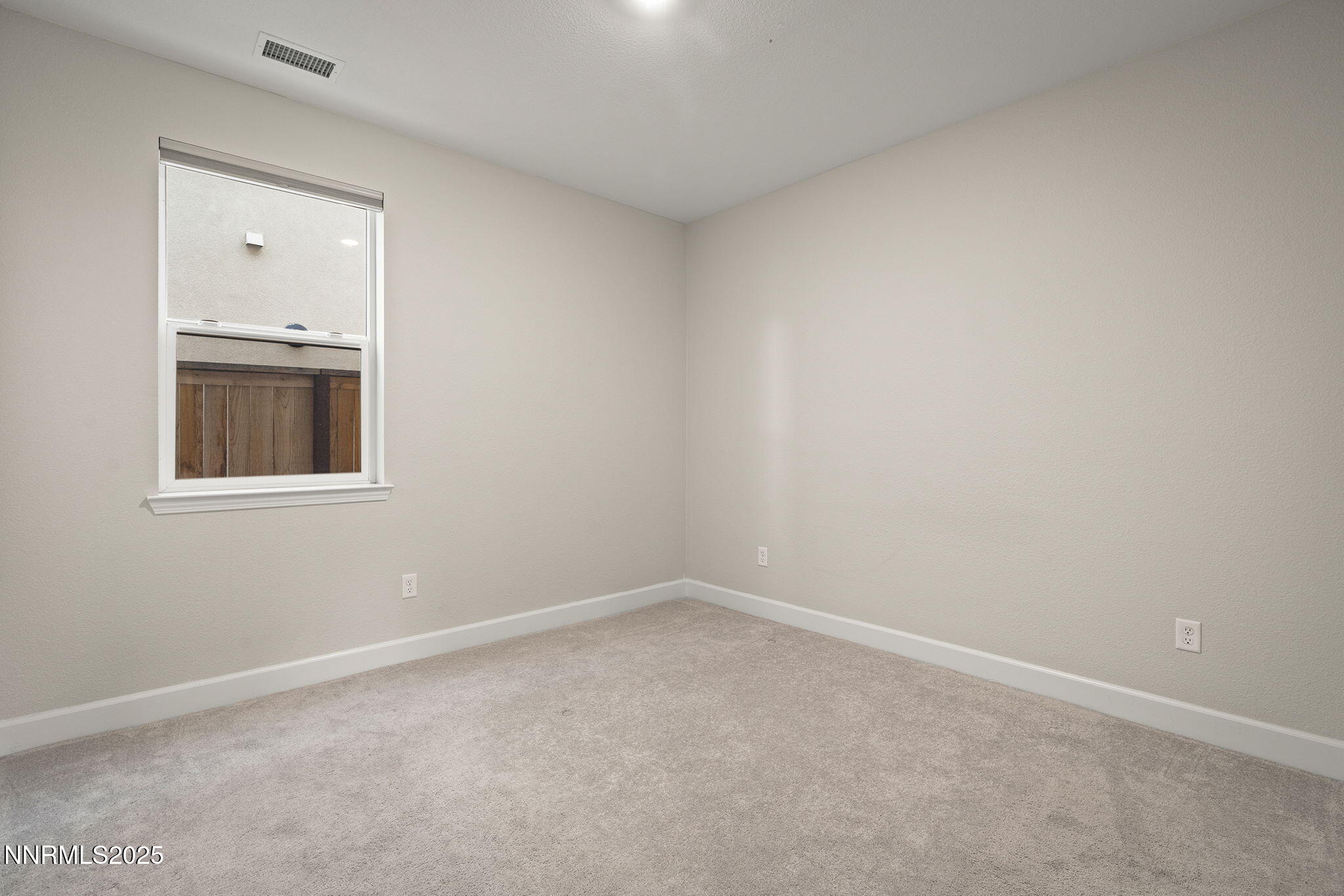 1119 Roswell Road Sparks, NV 89436 - Photo 25 of 35 an empty room with a window
