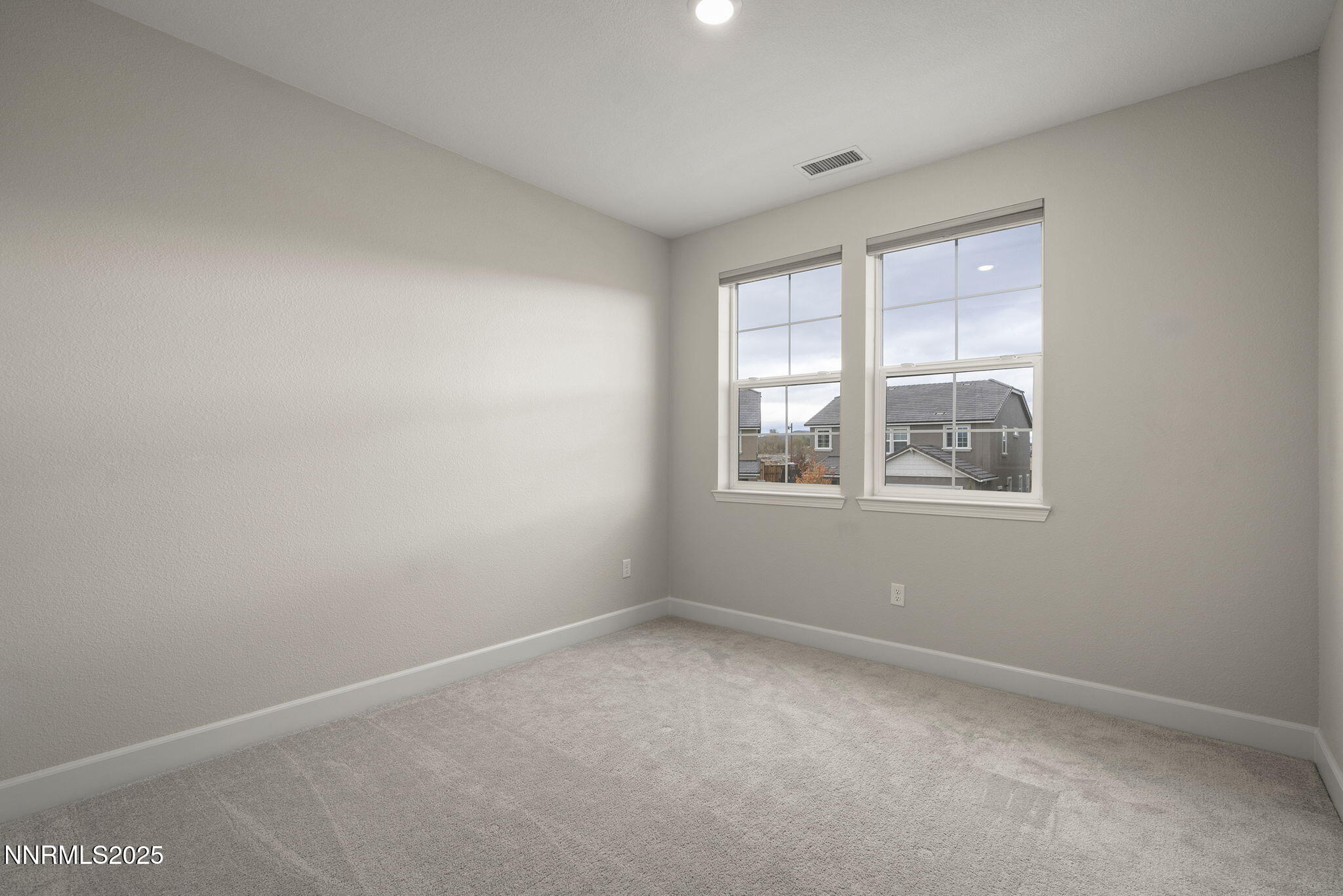 1119 Roswell Road Sparks, NV 89436 - Photo 27 of 35 an empty room with windows