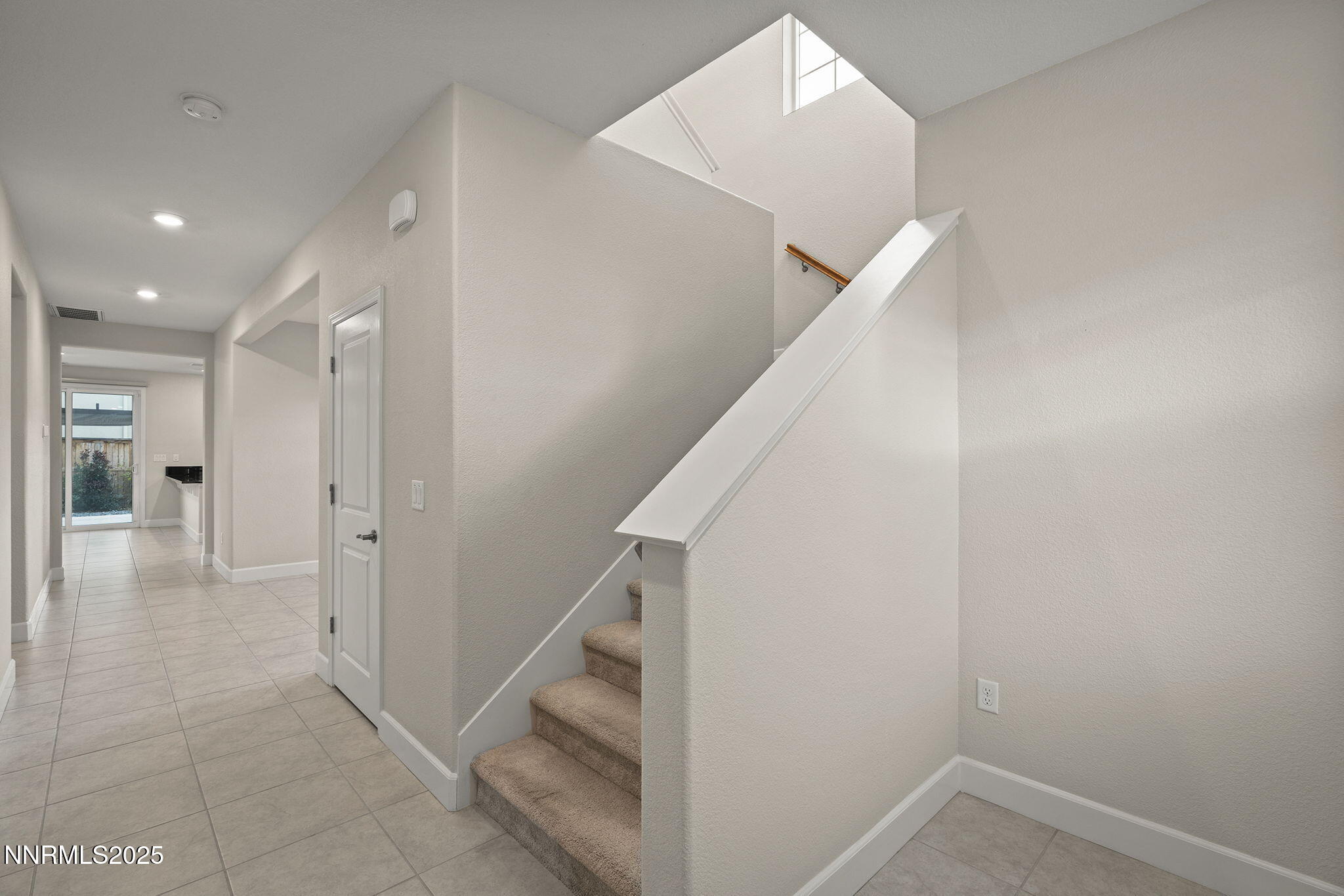 1119 Roswell Road Sparks, NV 89436 - Photo 8 of 35 a view of a hallway with staircase