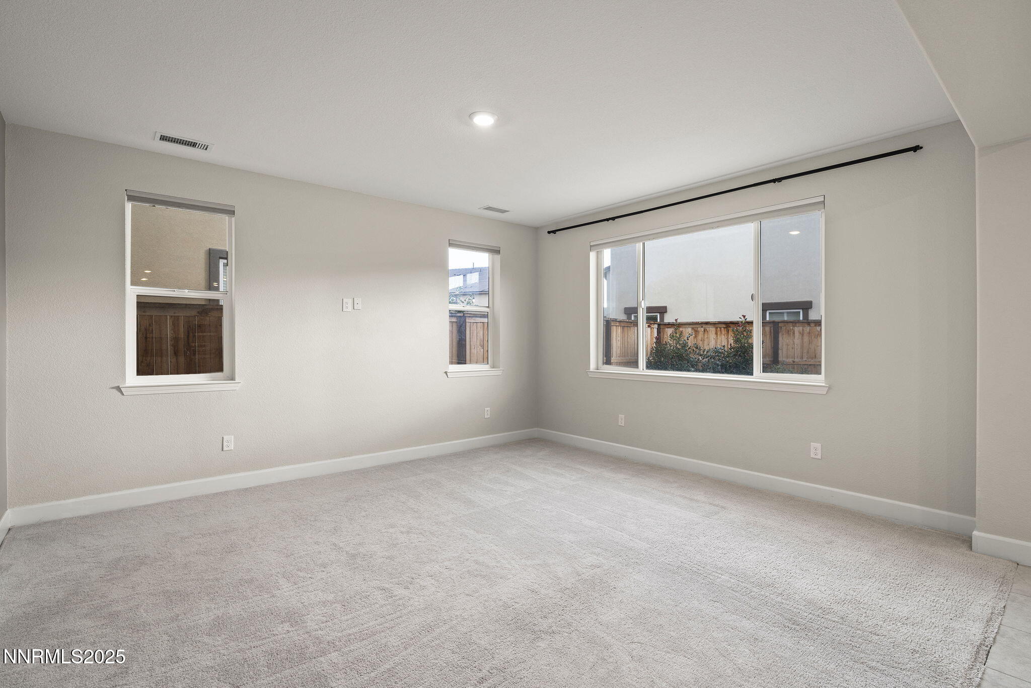1119 Roswell Road Sparks, NV 89436 - Photo 10 of 35 a view of an empty room with a window