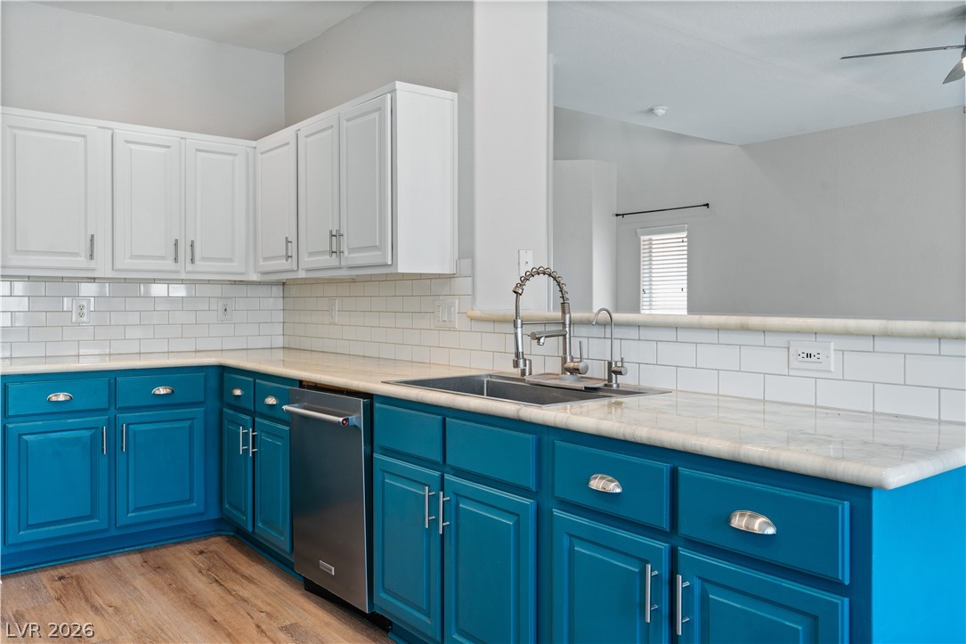 1328 Spice Ridge Court Henderson, NV 89012 - Photo 13 of 51 This modern kitchen features crisp cabinetry and durable countertops, perfect for everyday living.