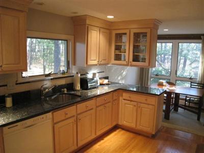 45 Cranberry Hollow Road Wellfleet, MA 02667 - Photo 12 of 26 a kitchen with a sink and cabinets